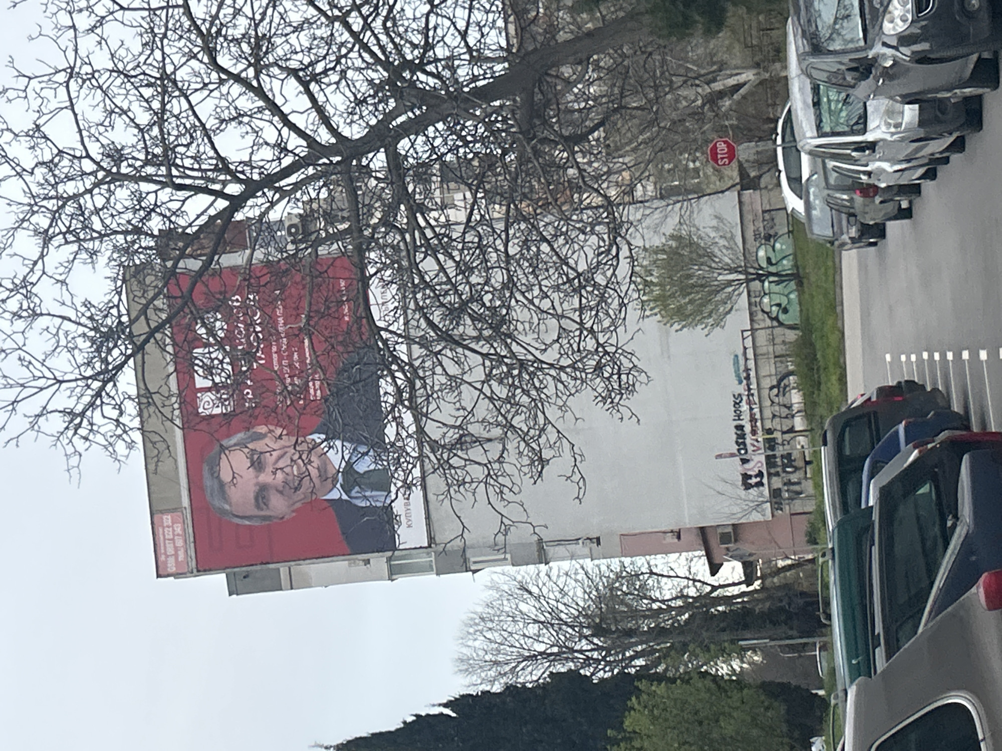 Political billboard spotted on Varna building displays suited figure