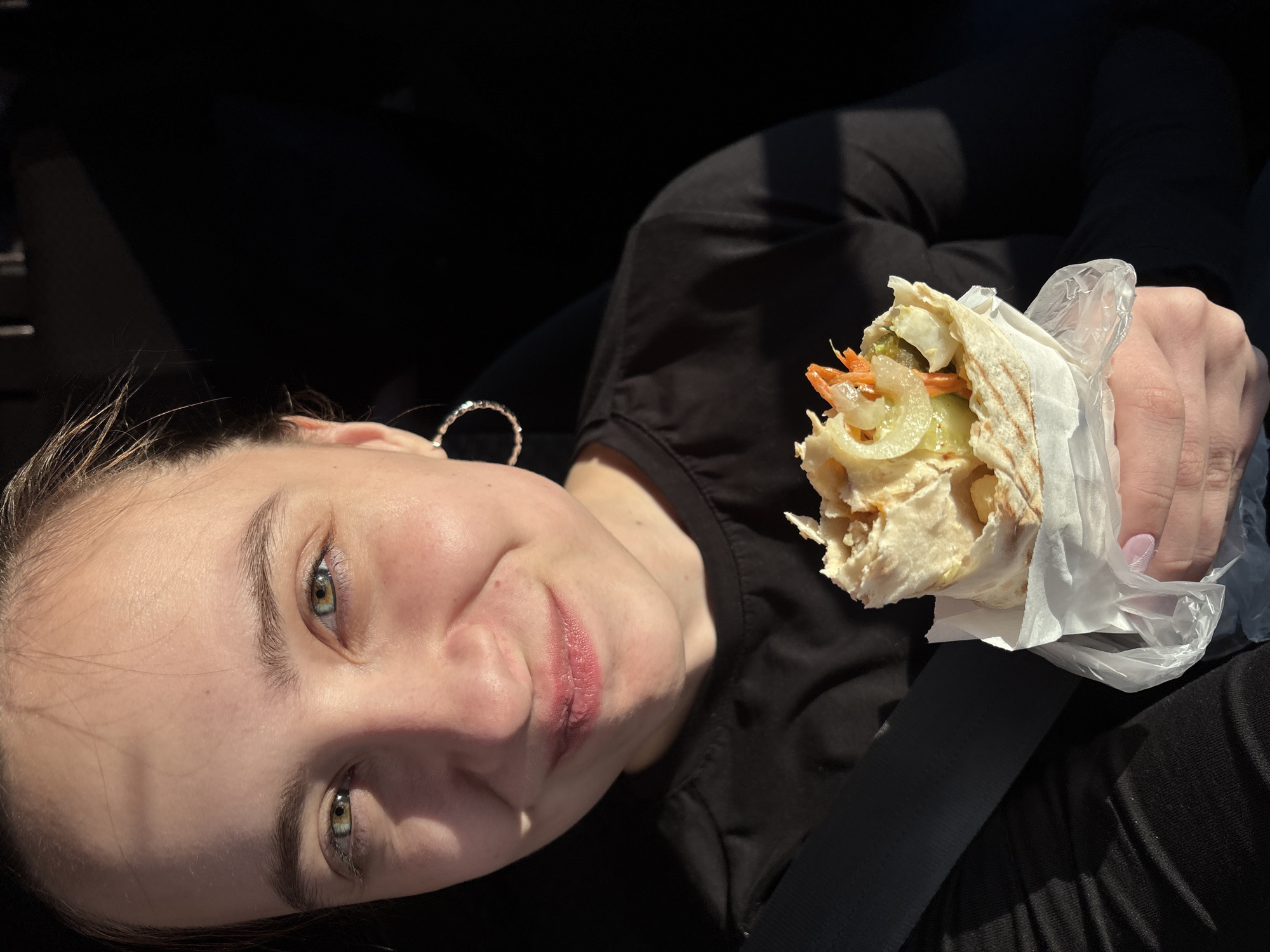Young woman photographed in car with food in Votkinsk