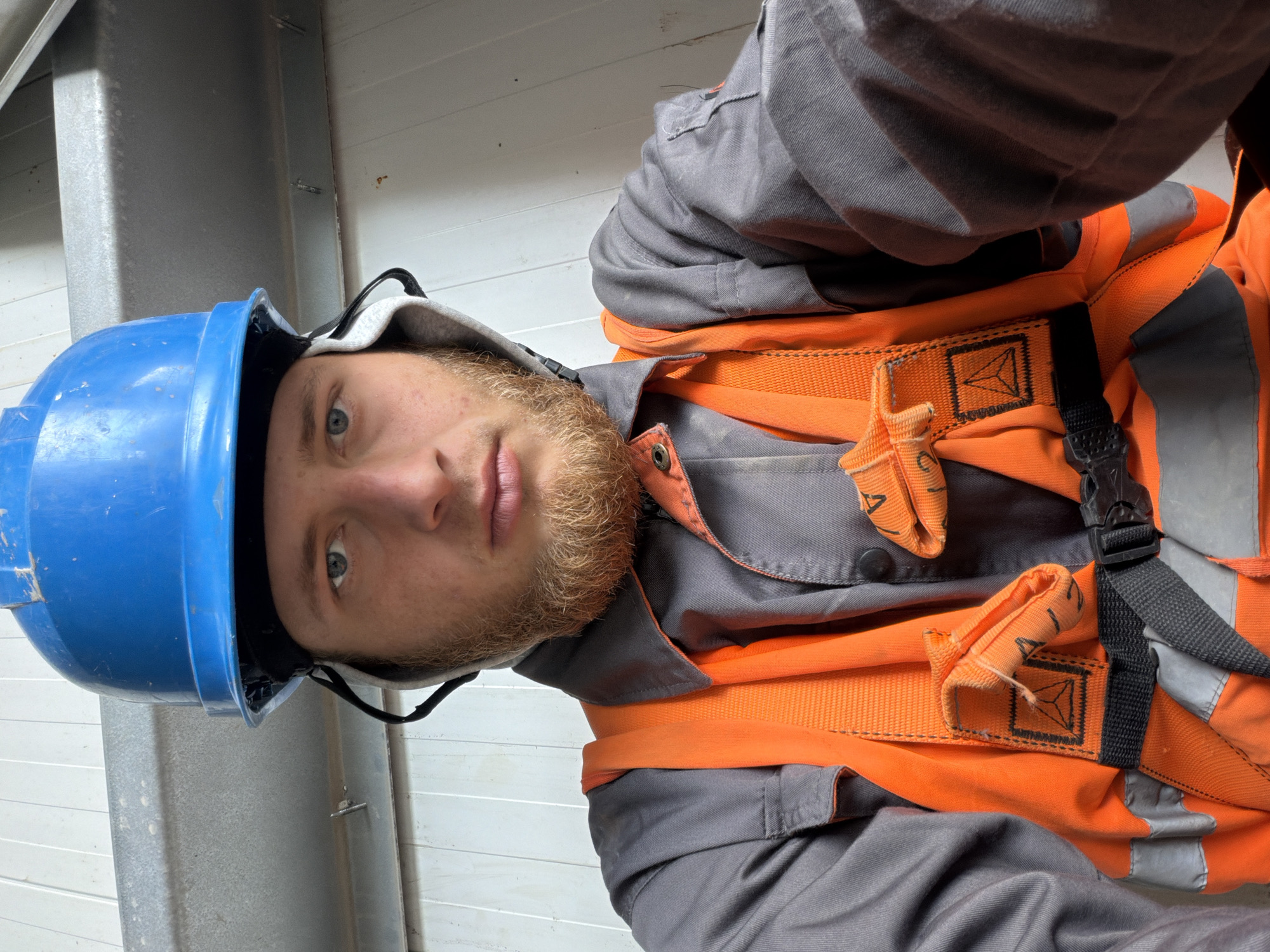Construction worker documents a morning shift at Polish industrial build site
