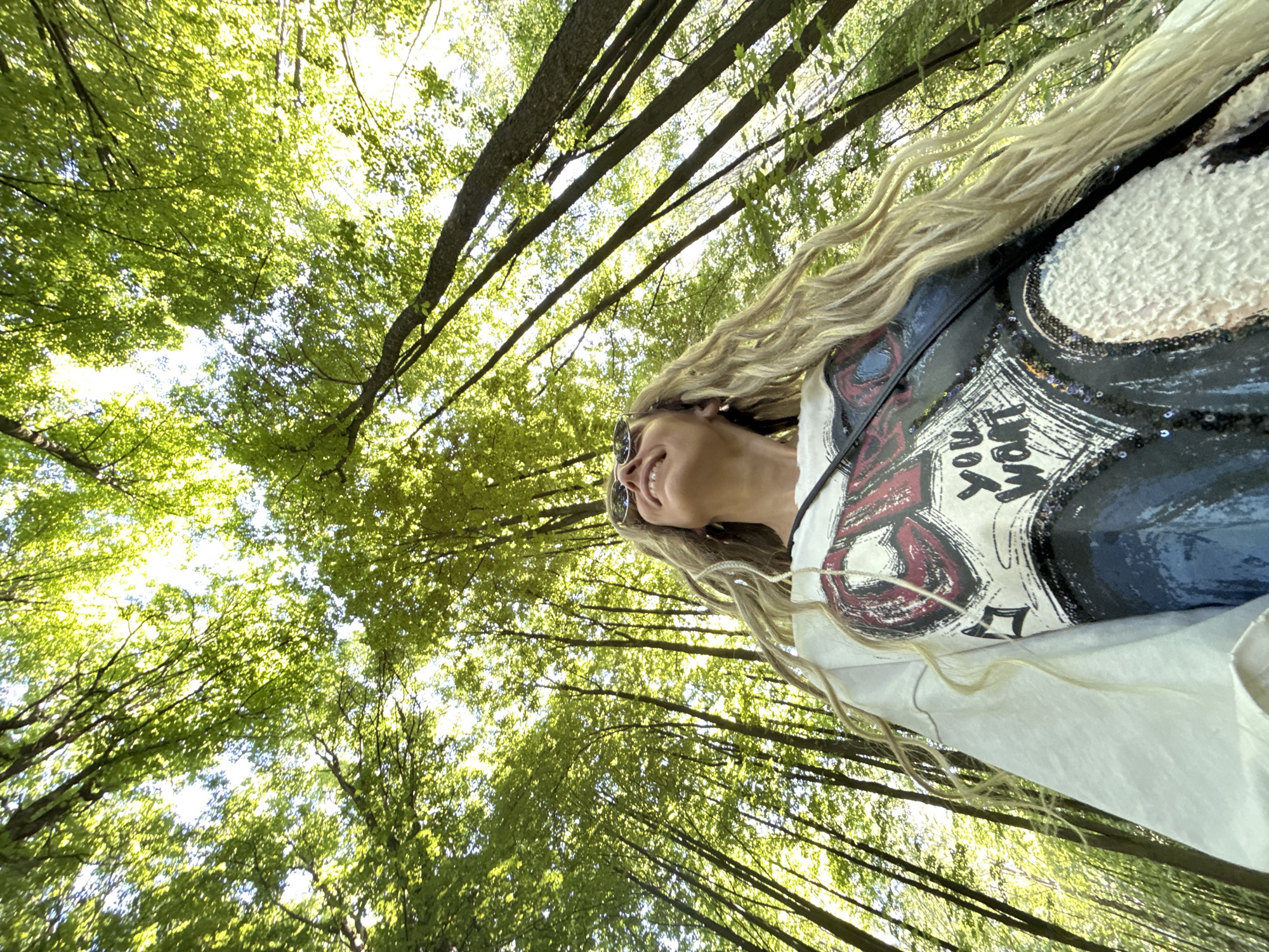Woman takes forest selfies in Rusanovo, Russia