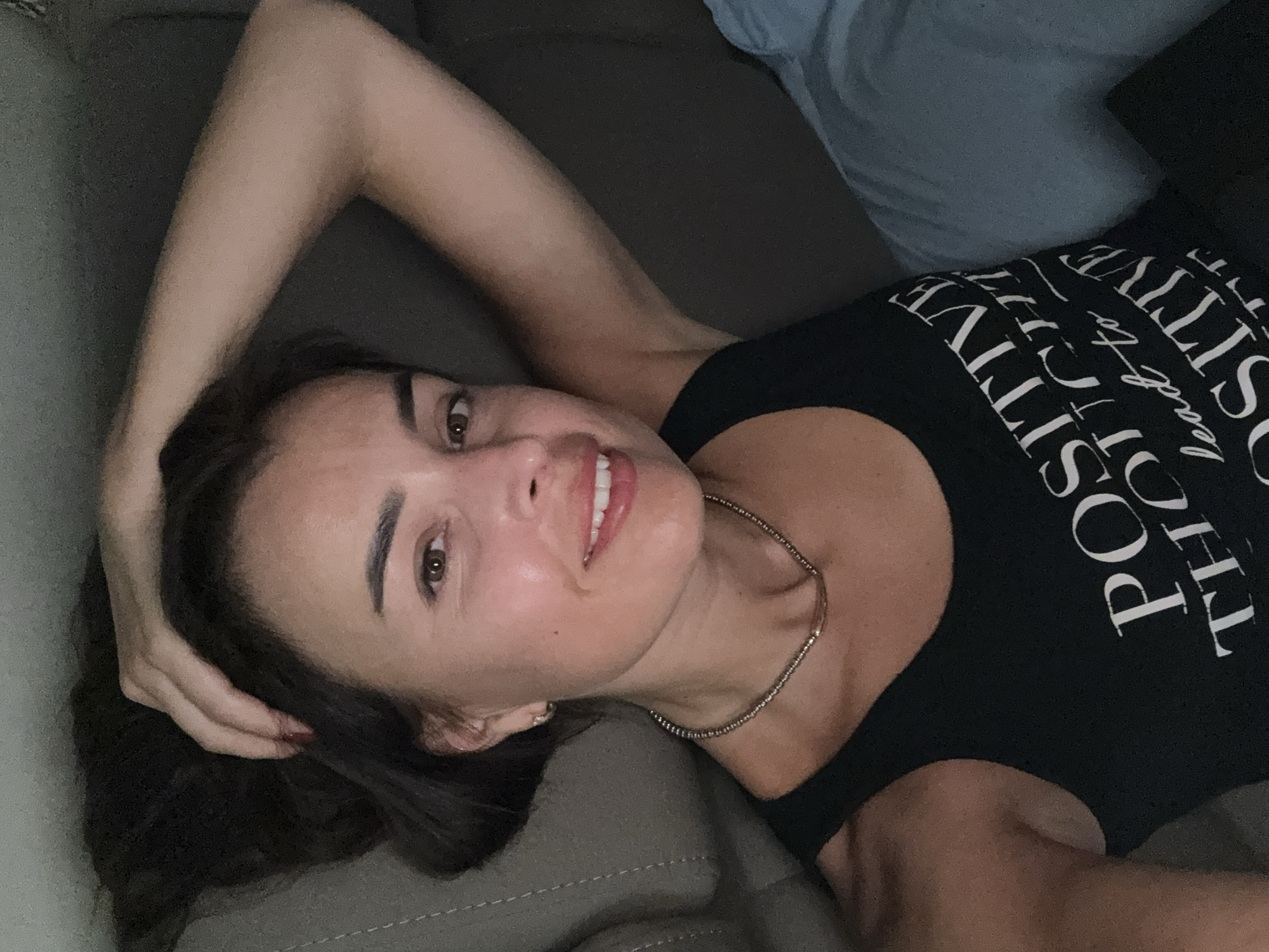 Couch moment in a motivational slogan tank top