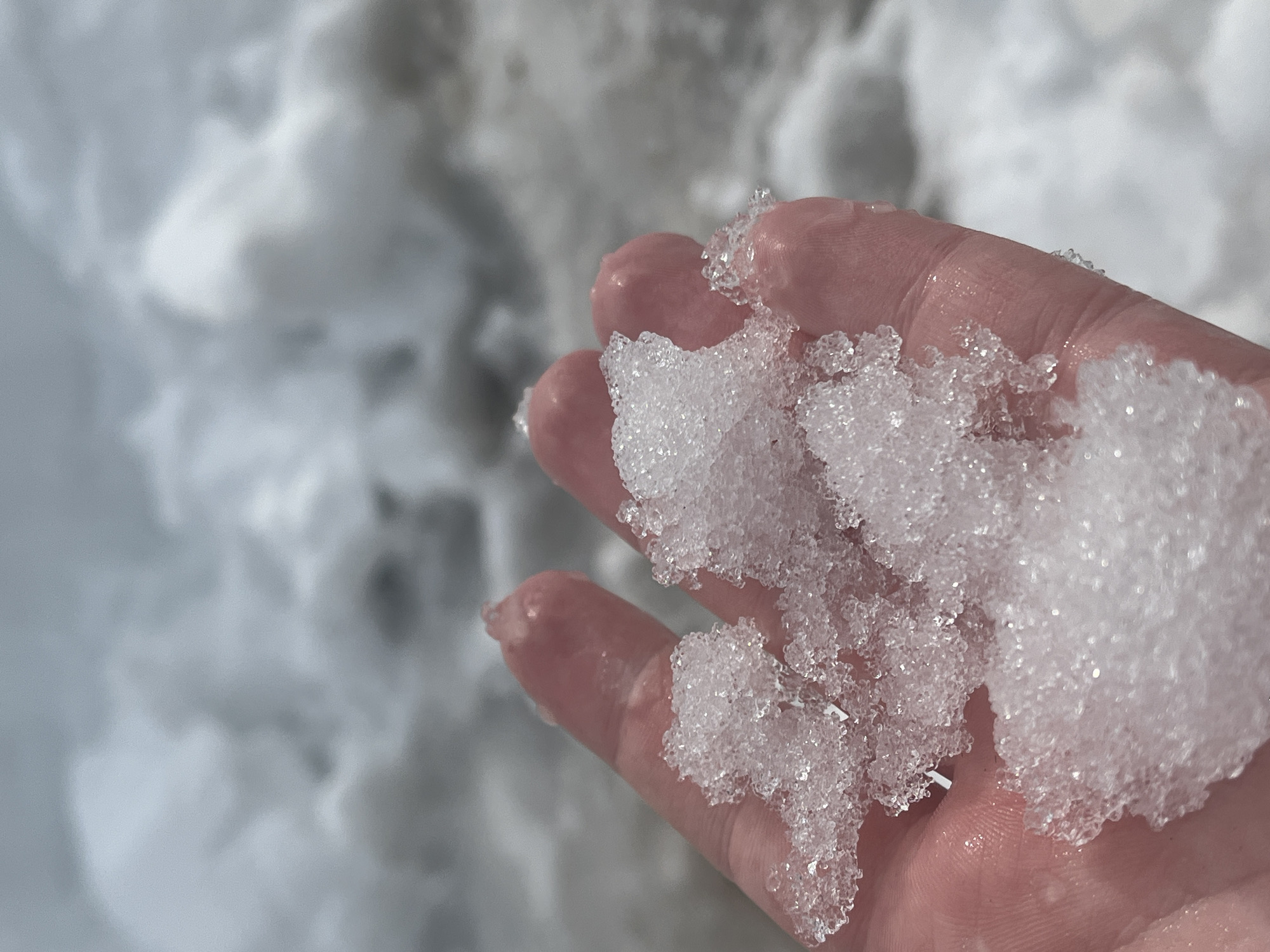 Hand holds melting ice in Pavlovka, Russia