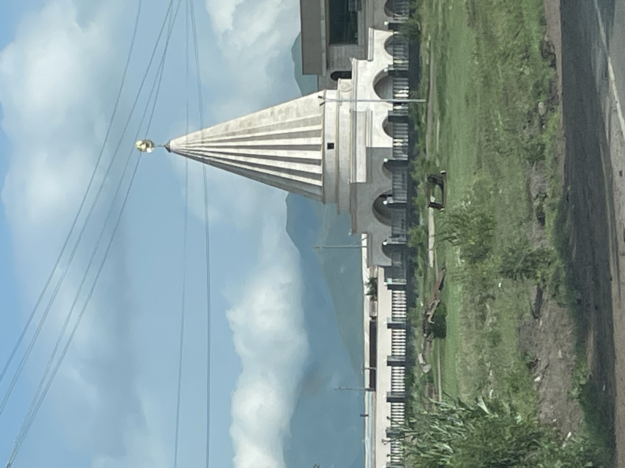 White religious building with golden crescent in Rya Taza, Armenia