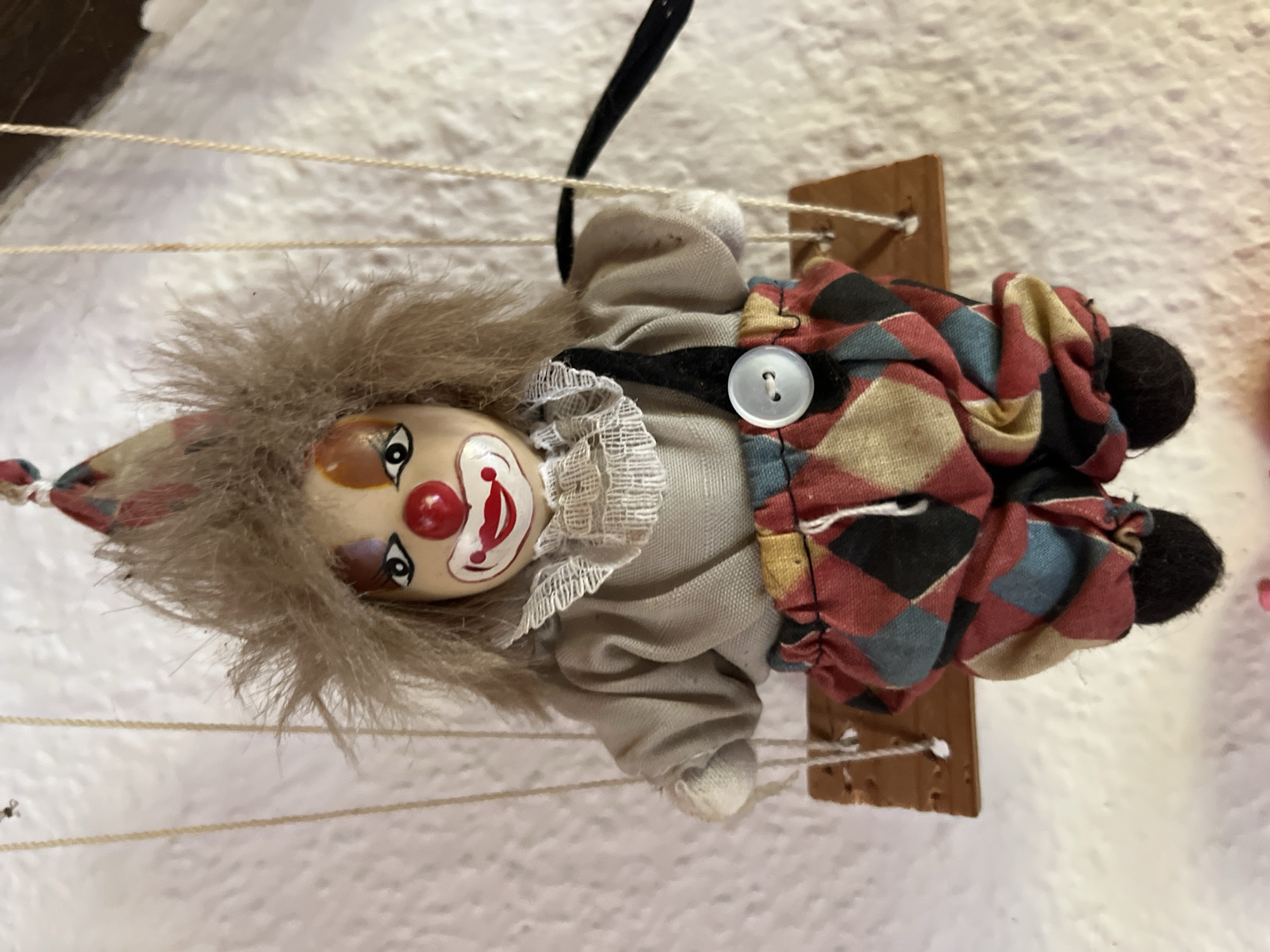 Eclectic personal collection of dolls, horror figures, and curios
