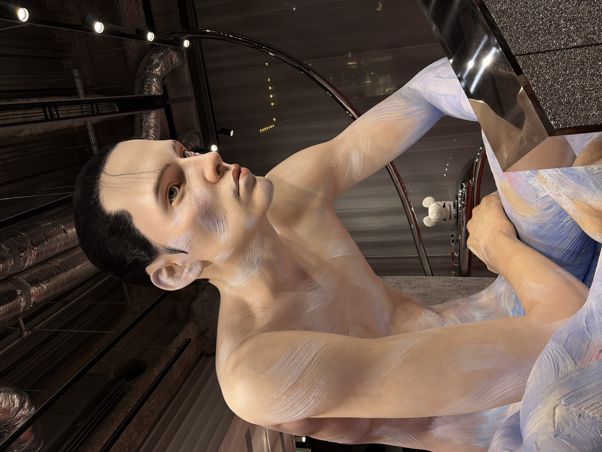 Visitors document hyperrealistic mannequin display in Chuo, Japan