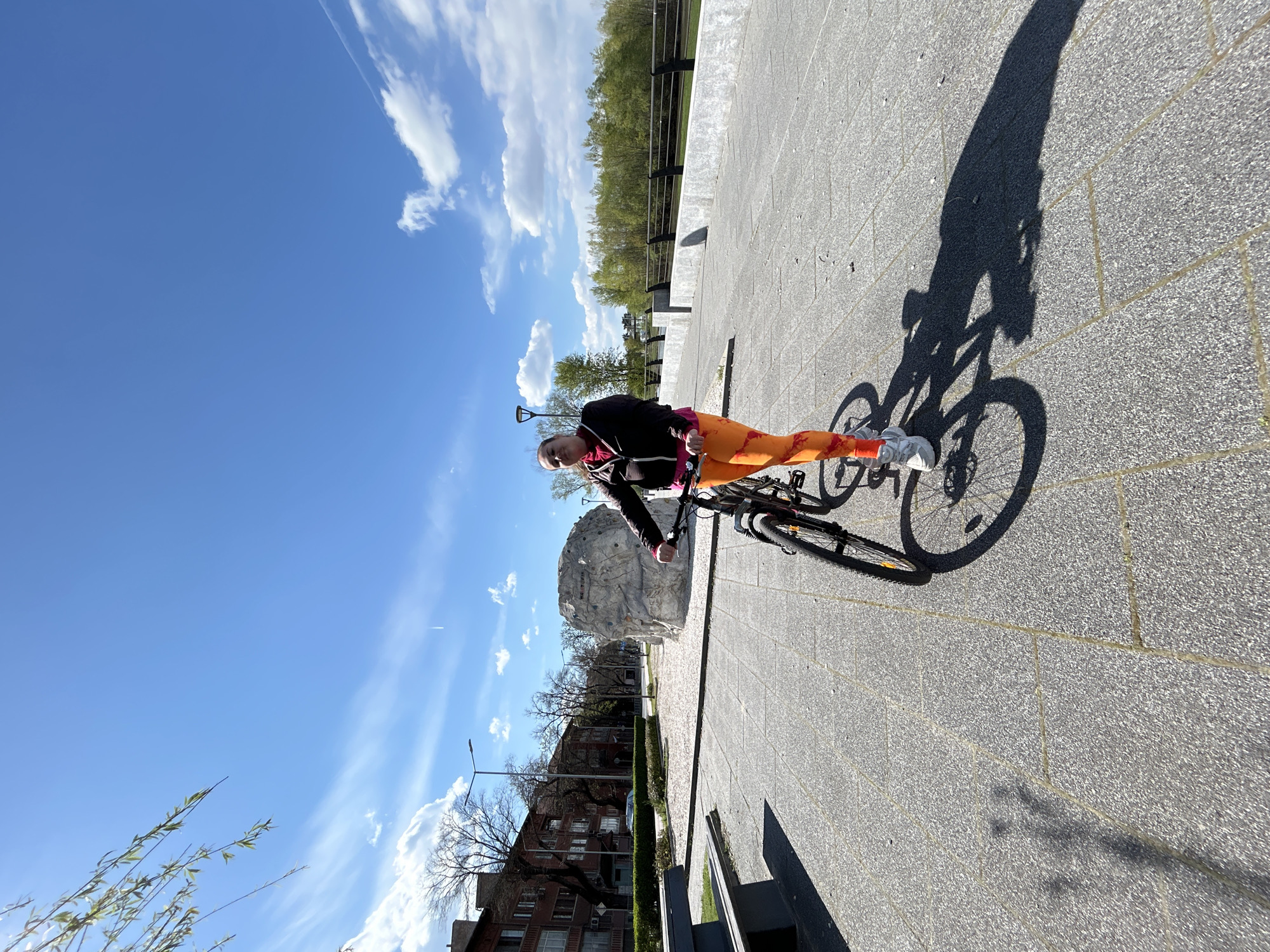 Cyclist spotted near climbing boulder in sunny Plovdiv afternoon