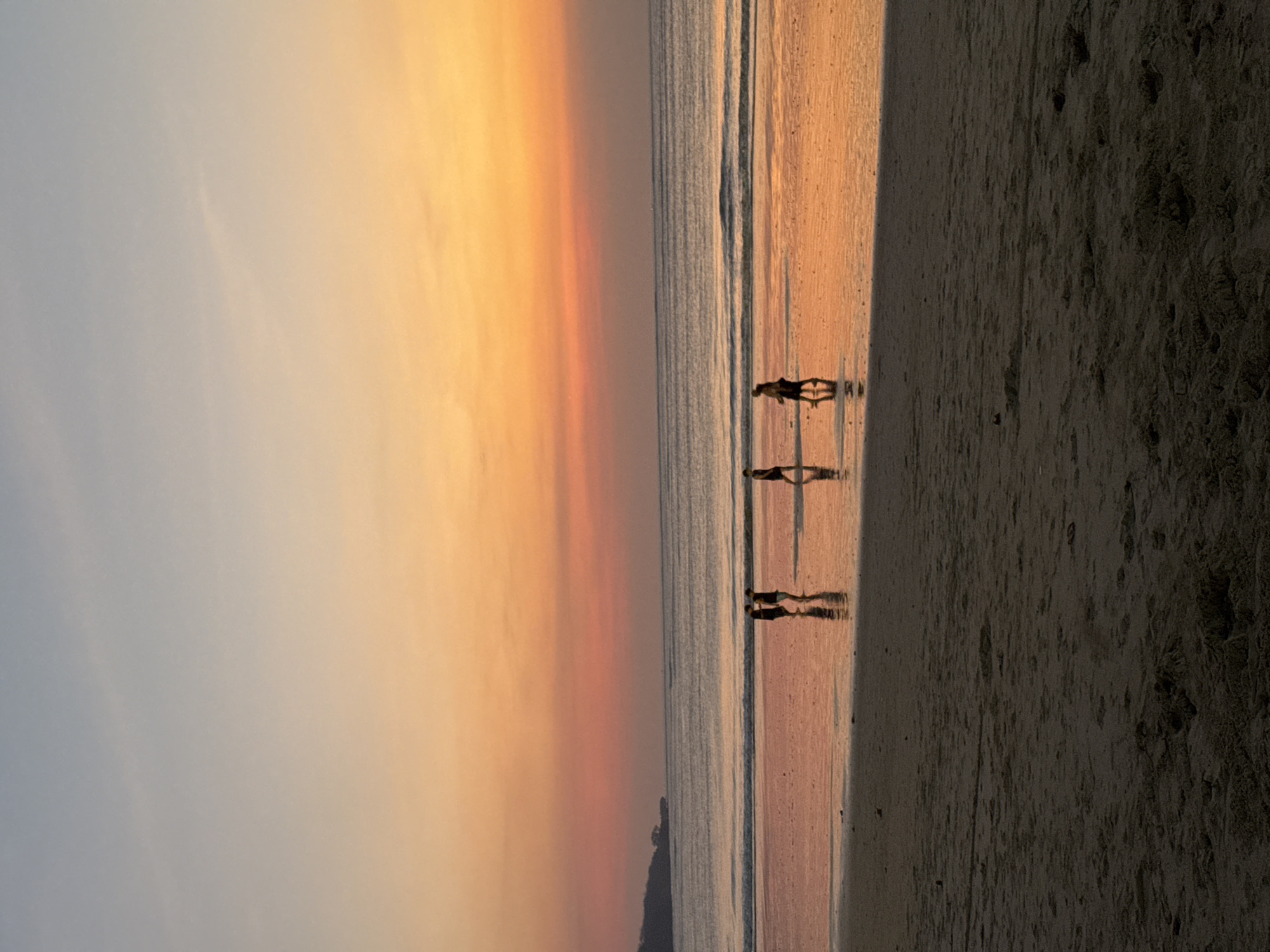 Golden hour at Kuta Beach, Bali — waves, silhouettes, sunset.
