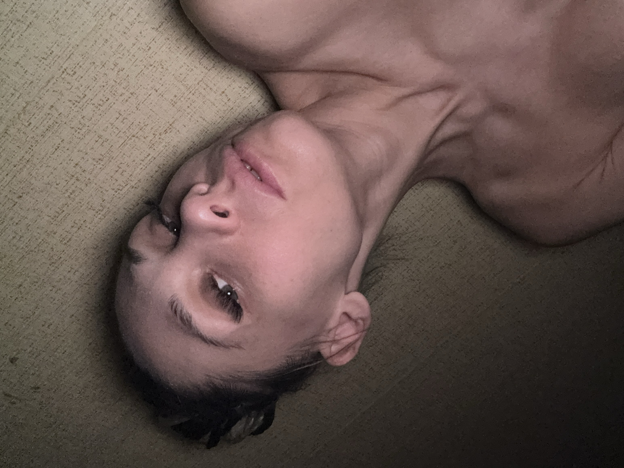Woman resting on couch in Rusanovo, Russia