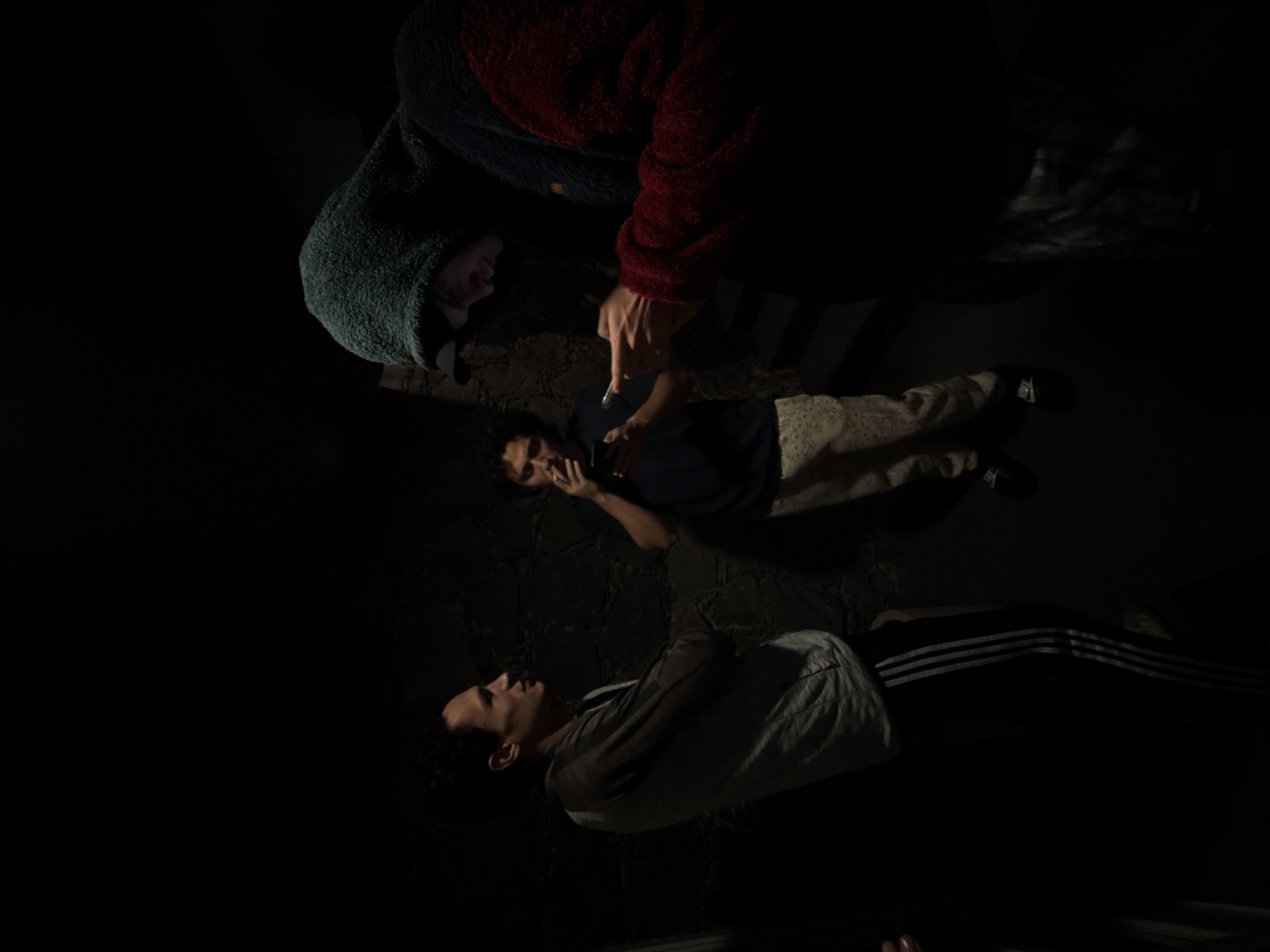 Three people rest on couch during early morning in Mexico City