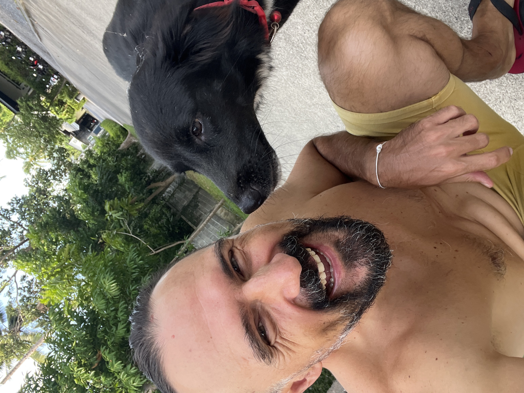 Selfies with a black dog at golden hour in Ko Samui