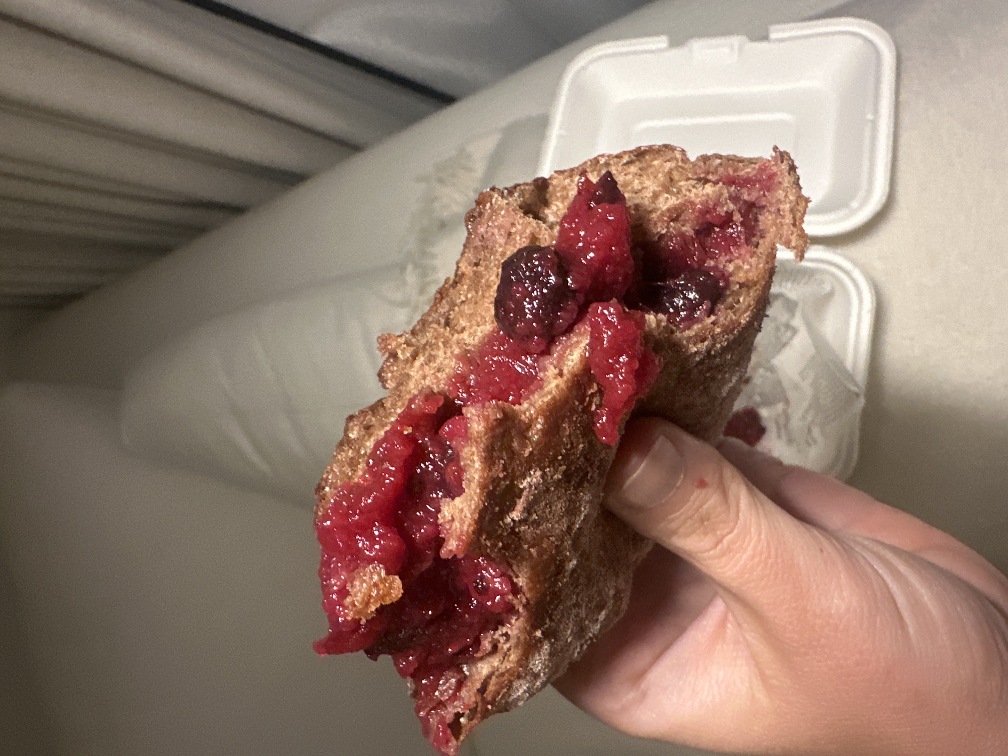 Person enjoys bread with spreads in Abu Dhabi