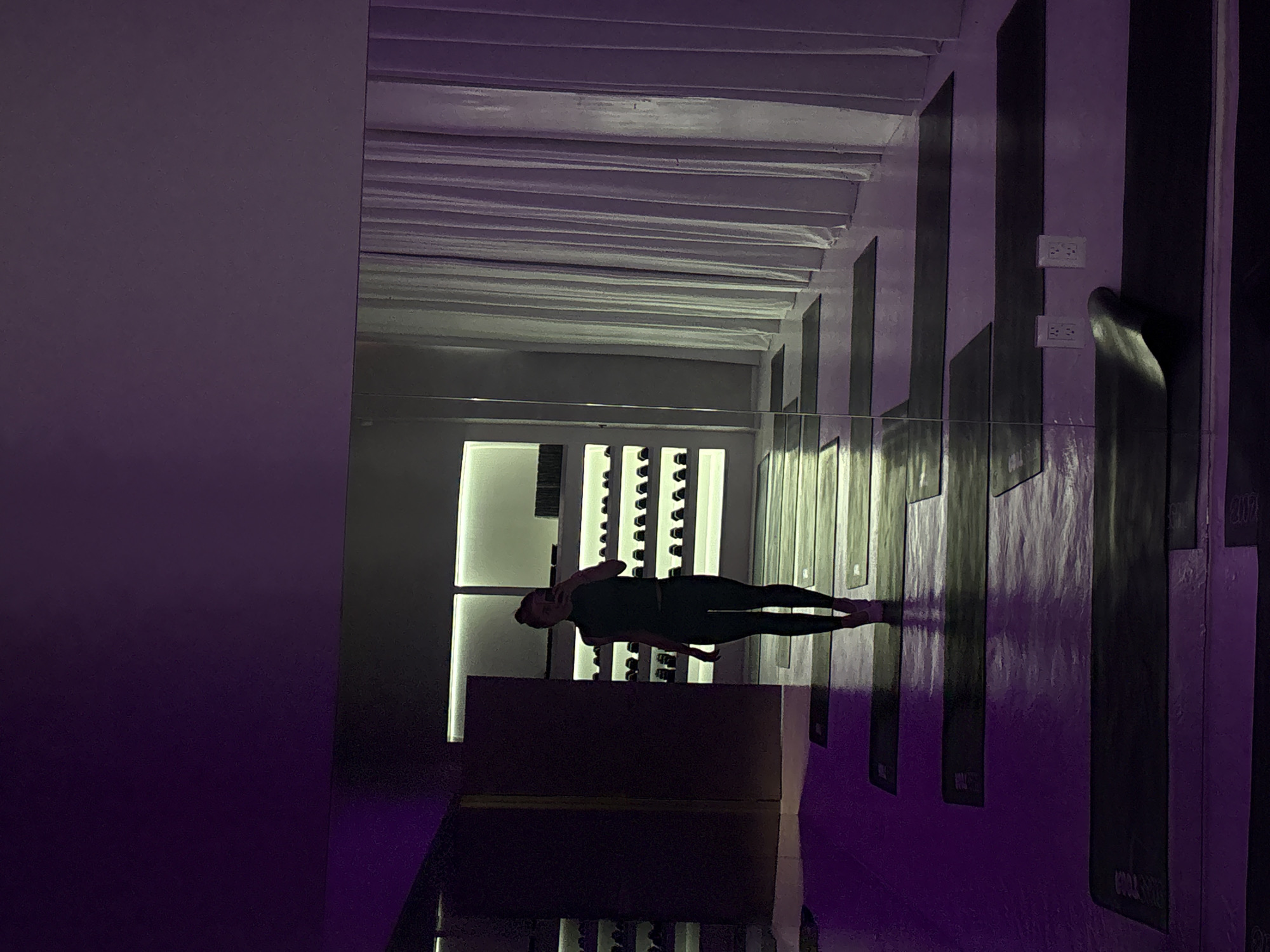 Inside a purple-lit yoga studio in Mexico City
