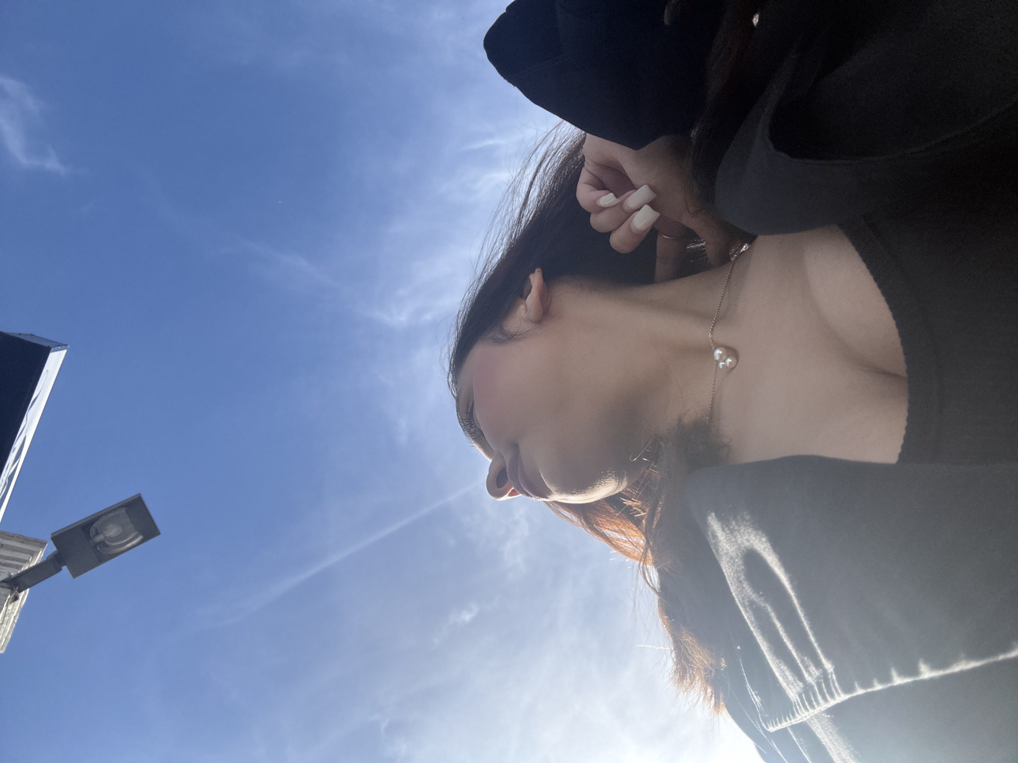 Woman photographed against blue sky in Mönchengladbach