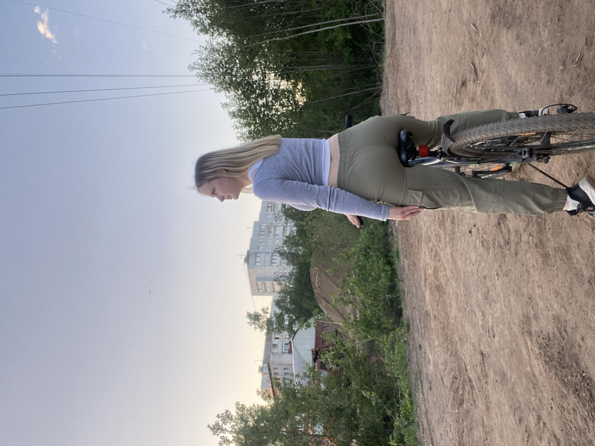 Woman cycles and takes selfies in Chaikovsky, Russia