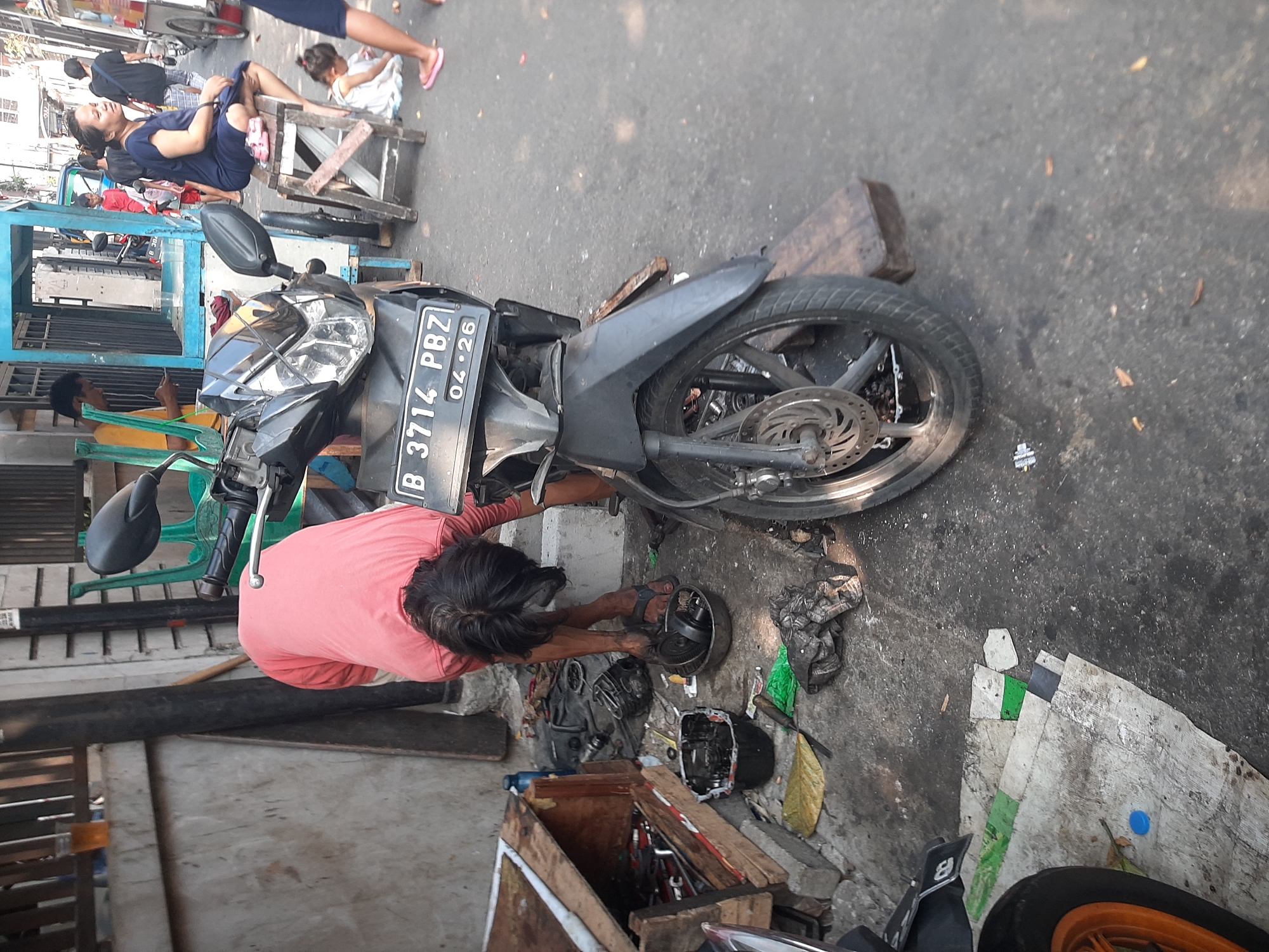Morning street life in a Central Jakarta neighborhood
