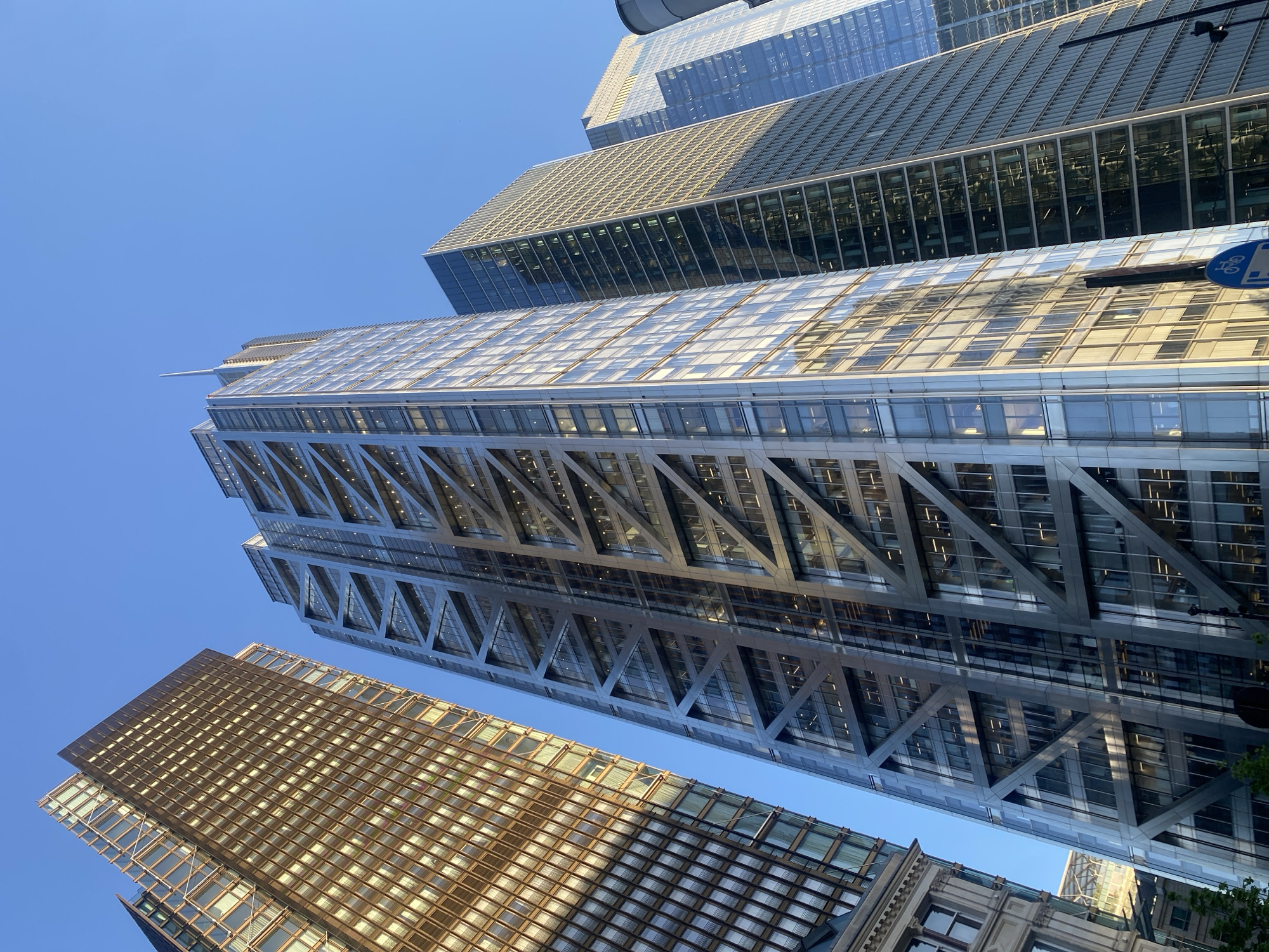 Modern London skyscrapers photographed from below against clear sky
