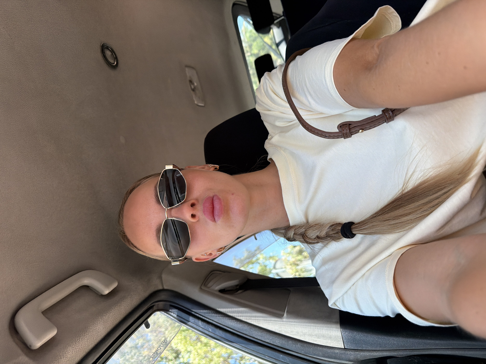 Inside a car in Benidorm, with the city streets outside