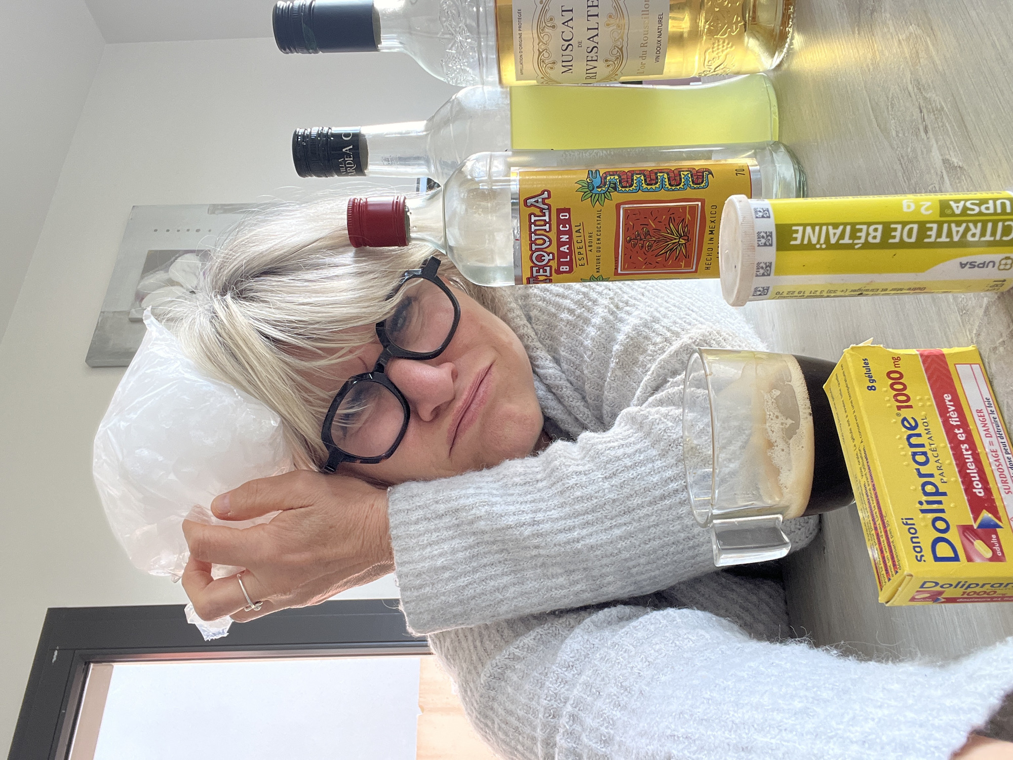 Woman documents hangover recovery with cat companion in France