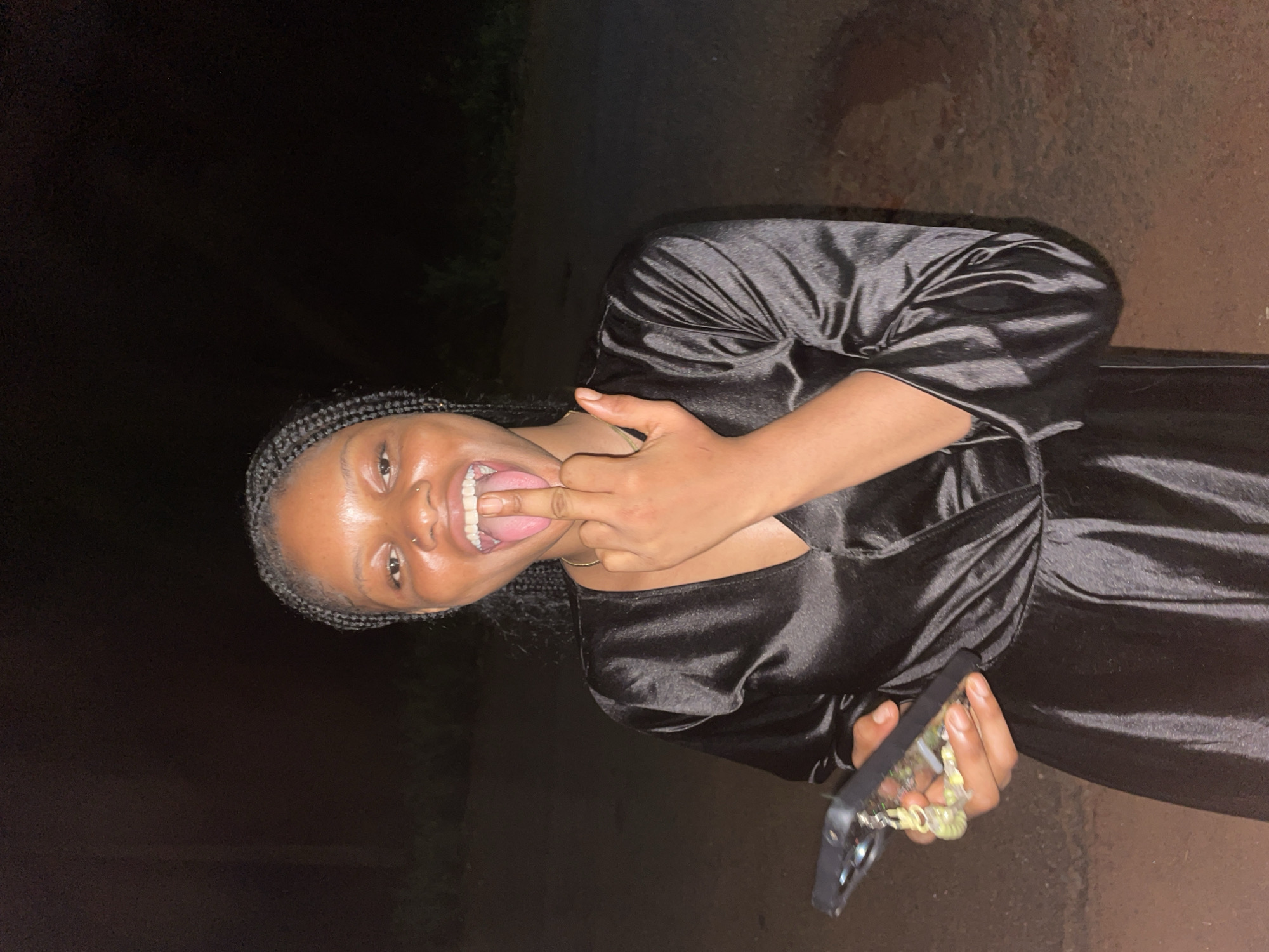 Woman poses for nighttime photos in Ogbe, Nigeria