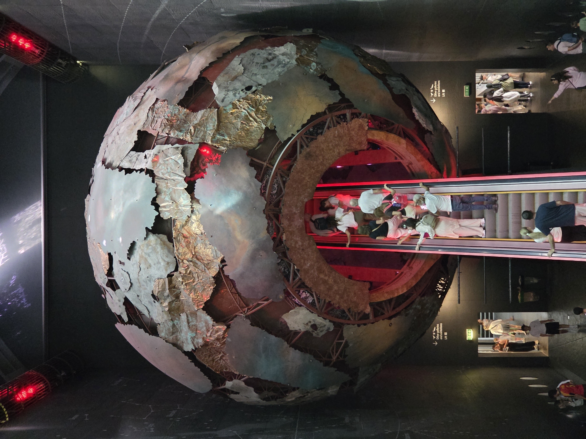Globe sculpture with escalator draws crowds at London Natural History Museum