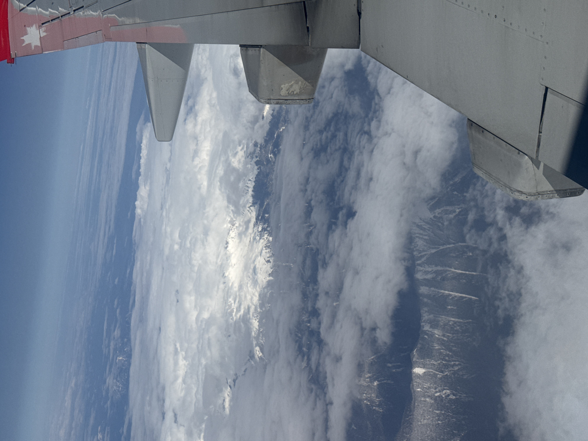 Aircraft flight documented over rural Russia with agricultural landscape views