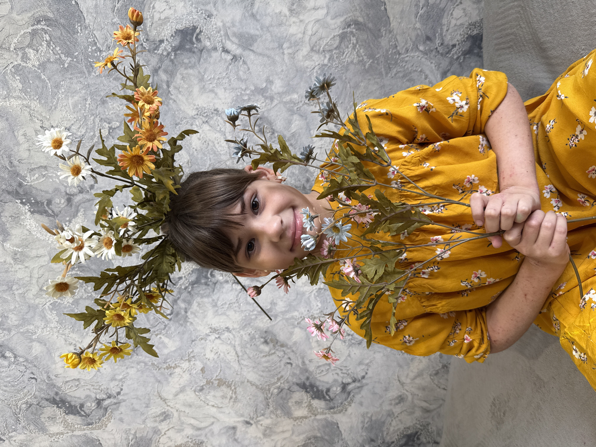 Children create art with window painting and flower arrangements