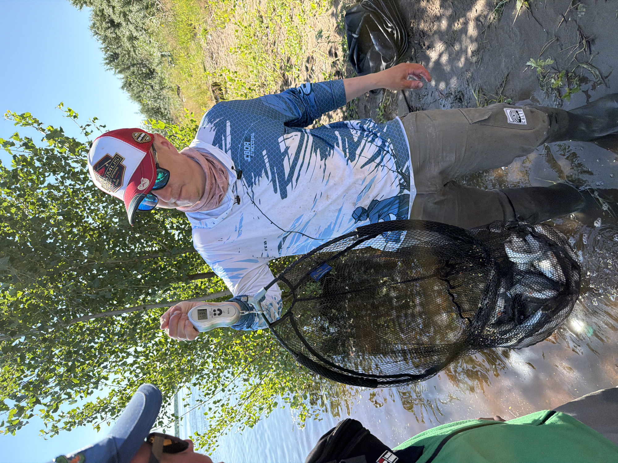 Fresh catch weighed at the water's edge in Tarasovo