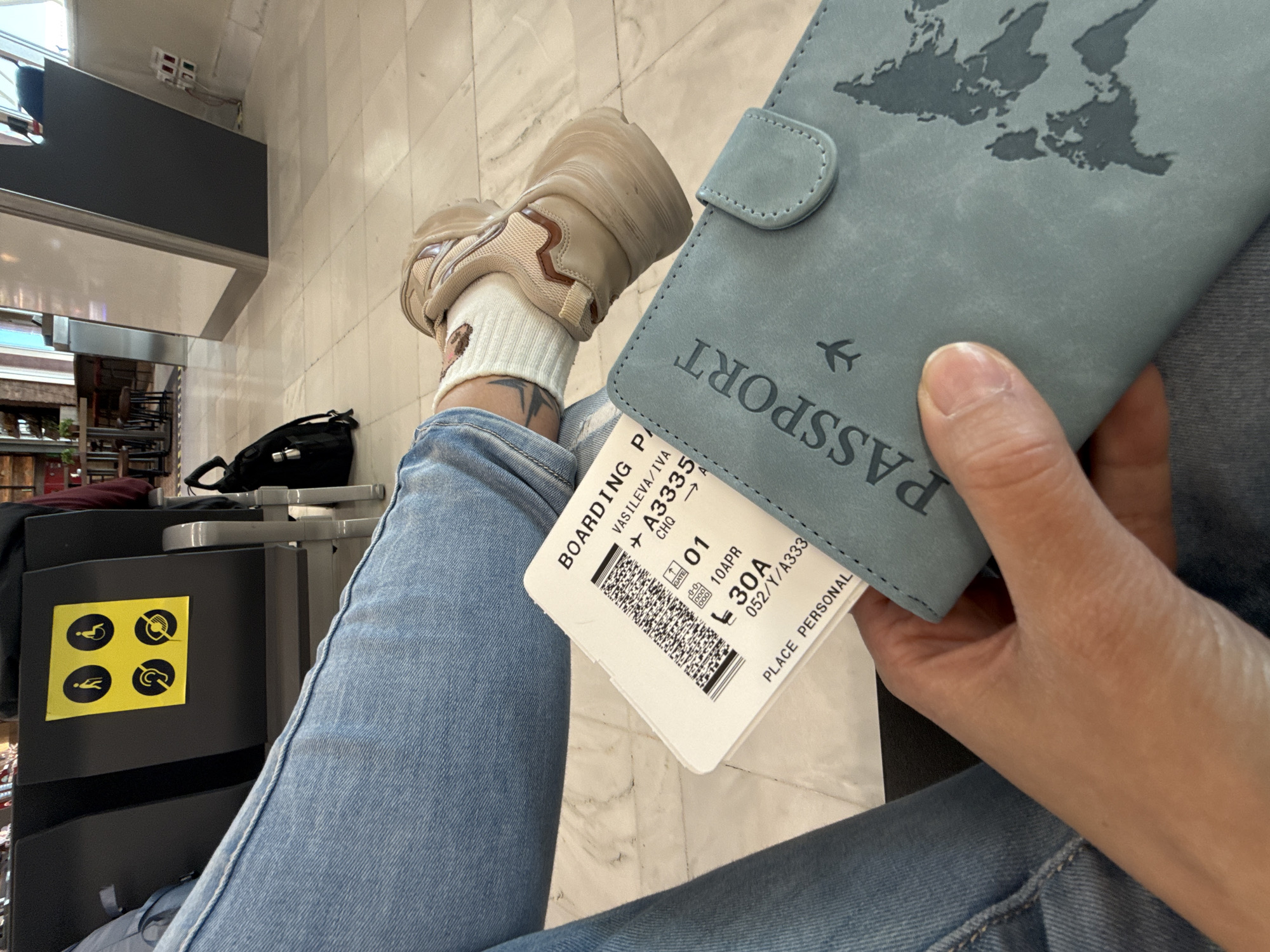 Traveler holds boarding pass at Chania Airport, Greece