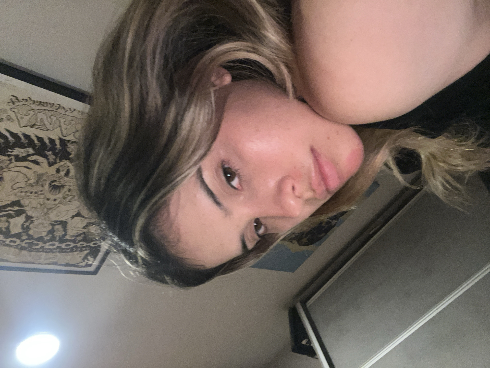 Woman records selfies in bedroom in Sumalao, Argentina