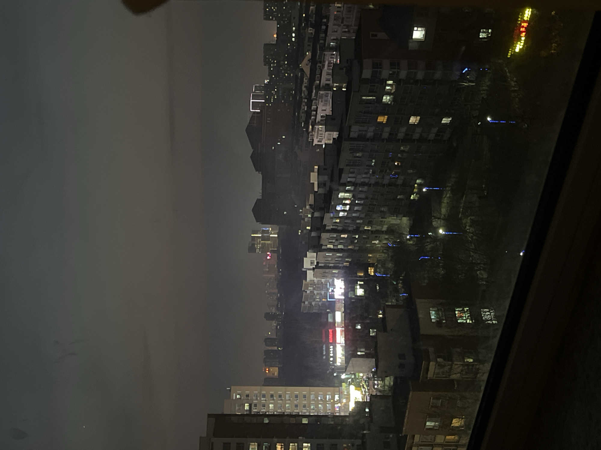 Night cityscape views captured through windows in Changchun