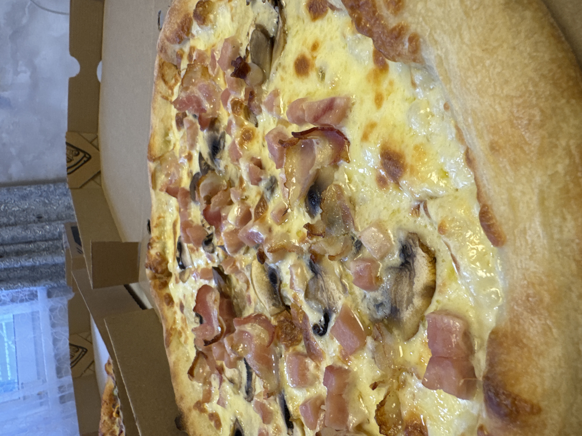 Ham and mushroom pizza fresh in the box, Vladivostok