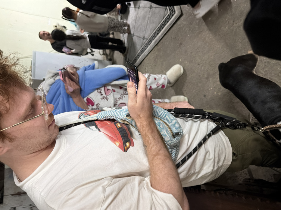 People gather in Tel Aviv area shelter, watch news