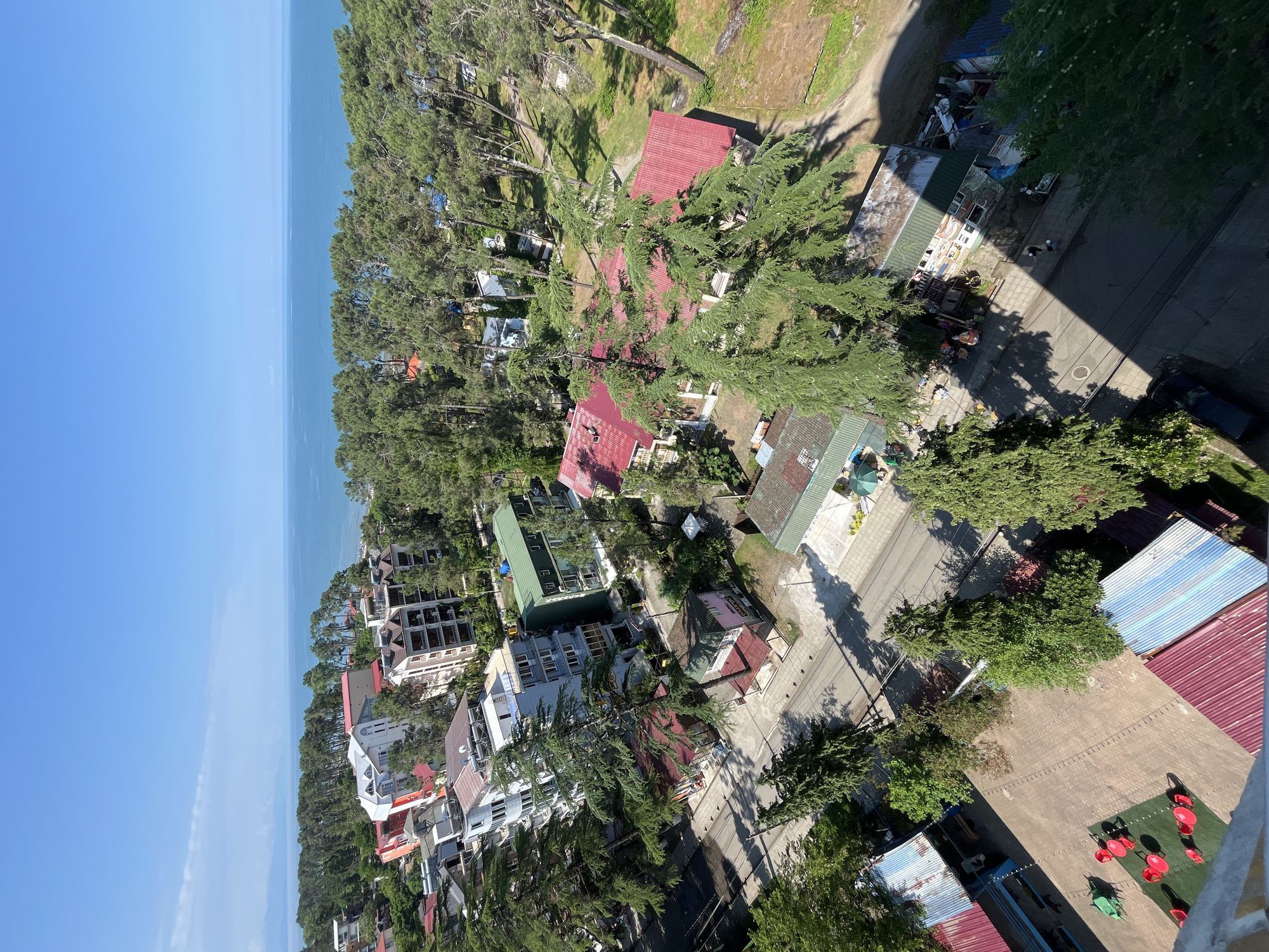 Aerial and rooftop views of Ureki's magnetic sand beach town