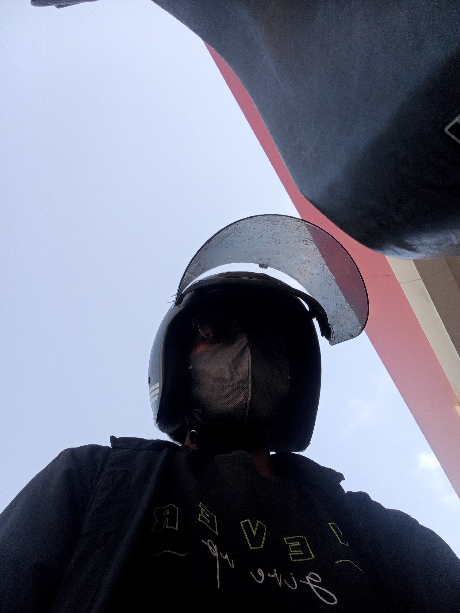 Motorcycle rider fuels up at Surabaya Pertamina station