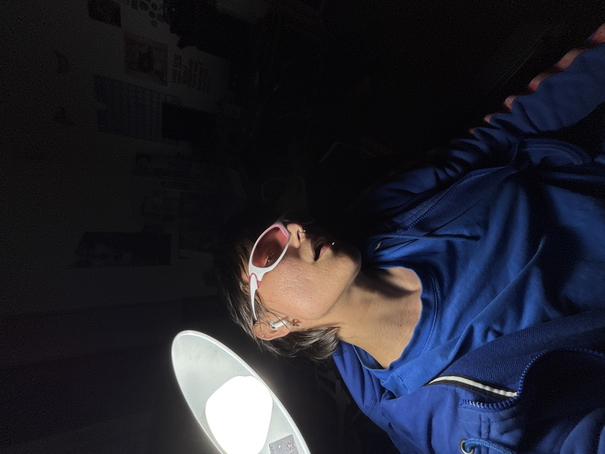 Person in pink-tinted sunglasses spotted in Sofia room