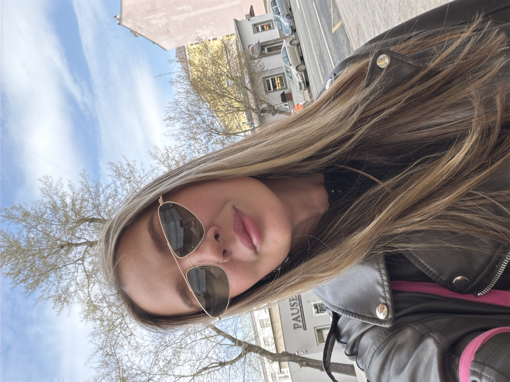 Woman takes selfie on sunny morning in Moscow