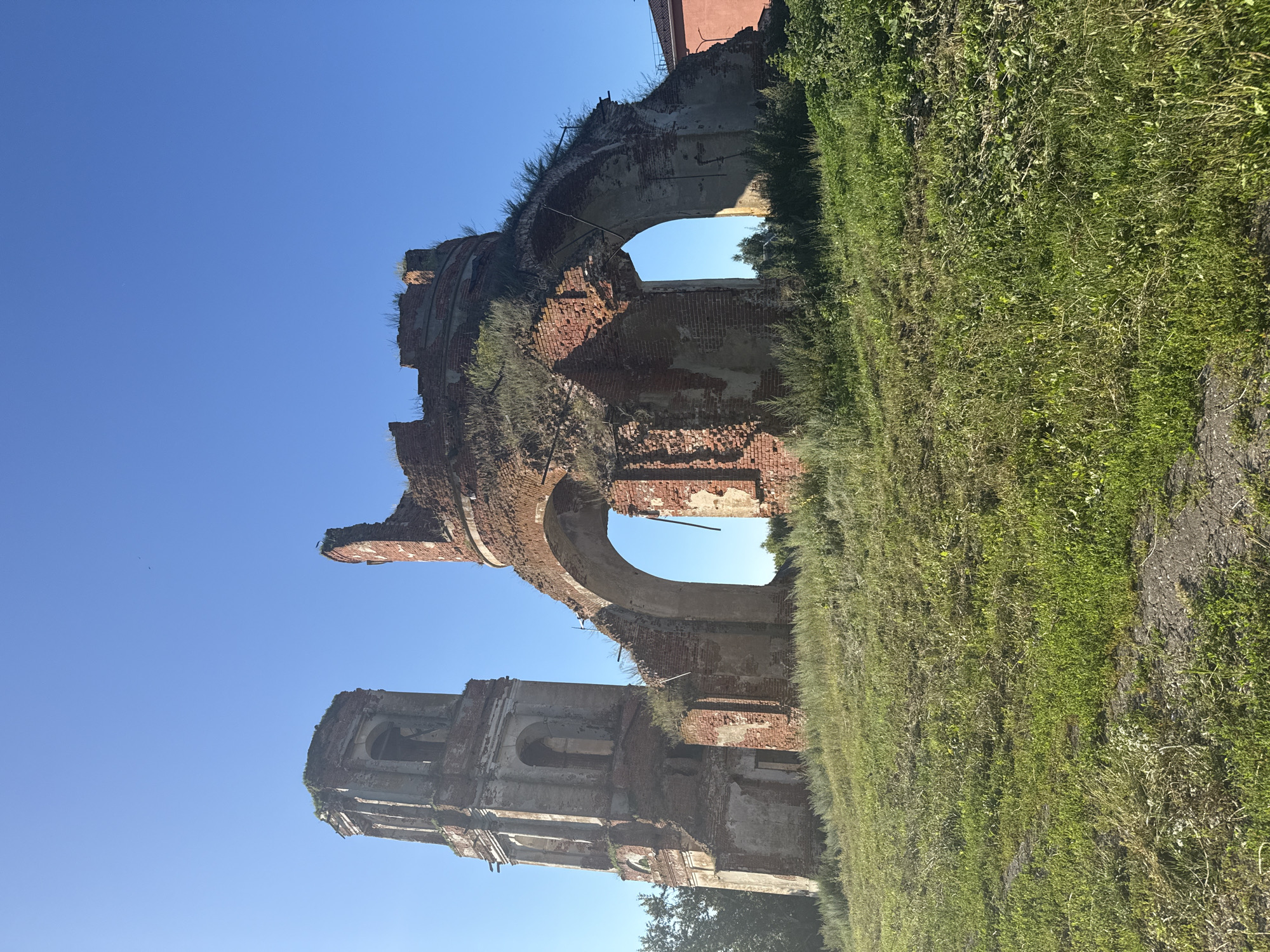 Afternoon at an Orthodox monastery with ruins, domes, and grounds