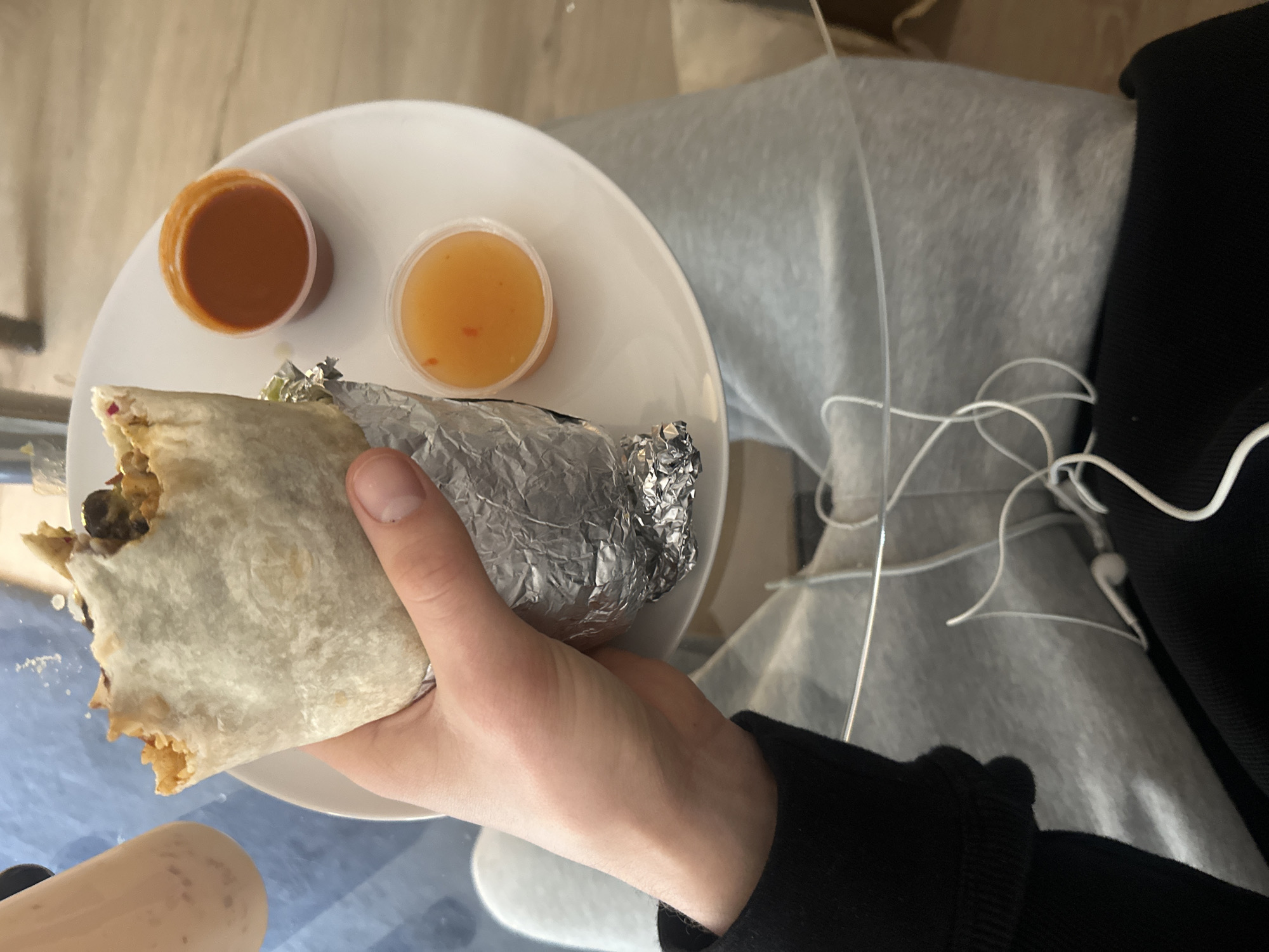 Londoner captures overhead shot of burrito lunch with condiments