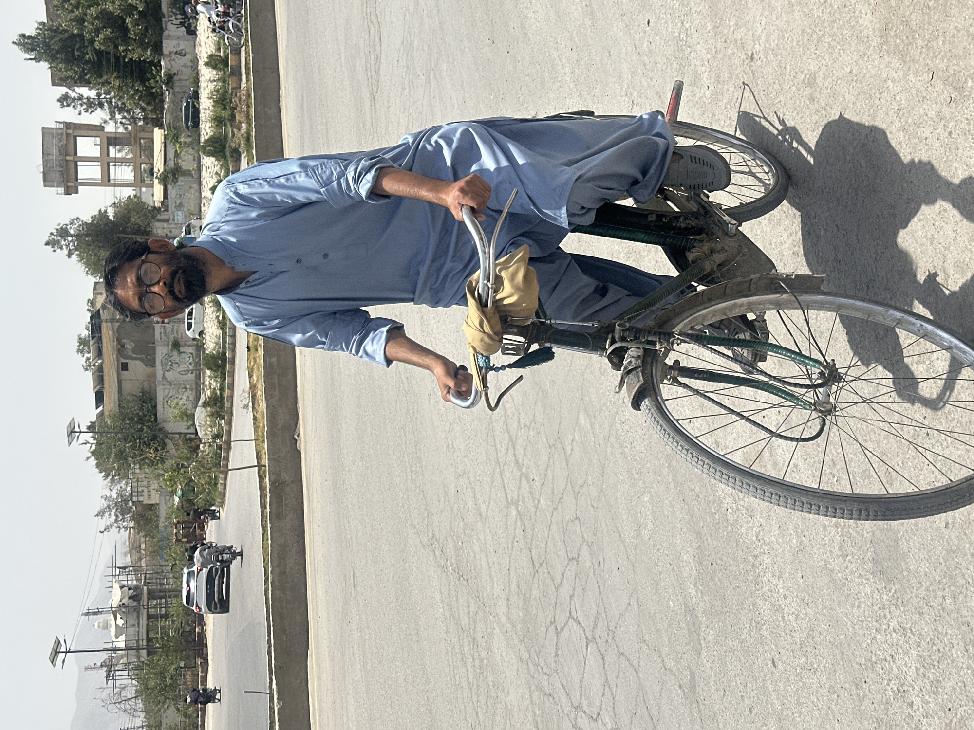 Cycling through Quetta's streets in a light blue shalwar kameez
