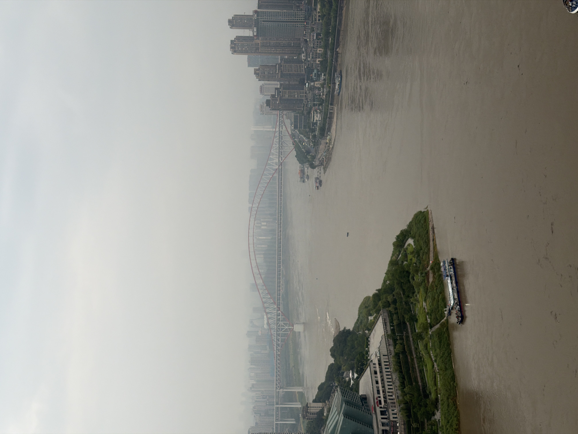 Chongqing's Yuzhong District skyline and riverfront on a cloudy evening