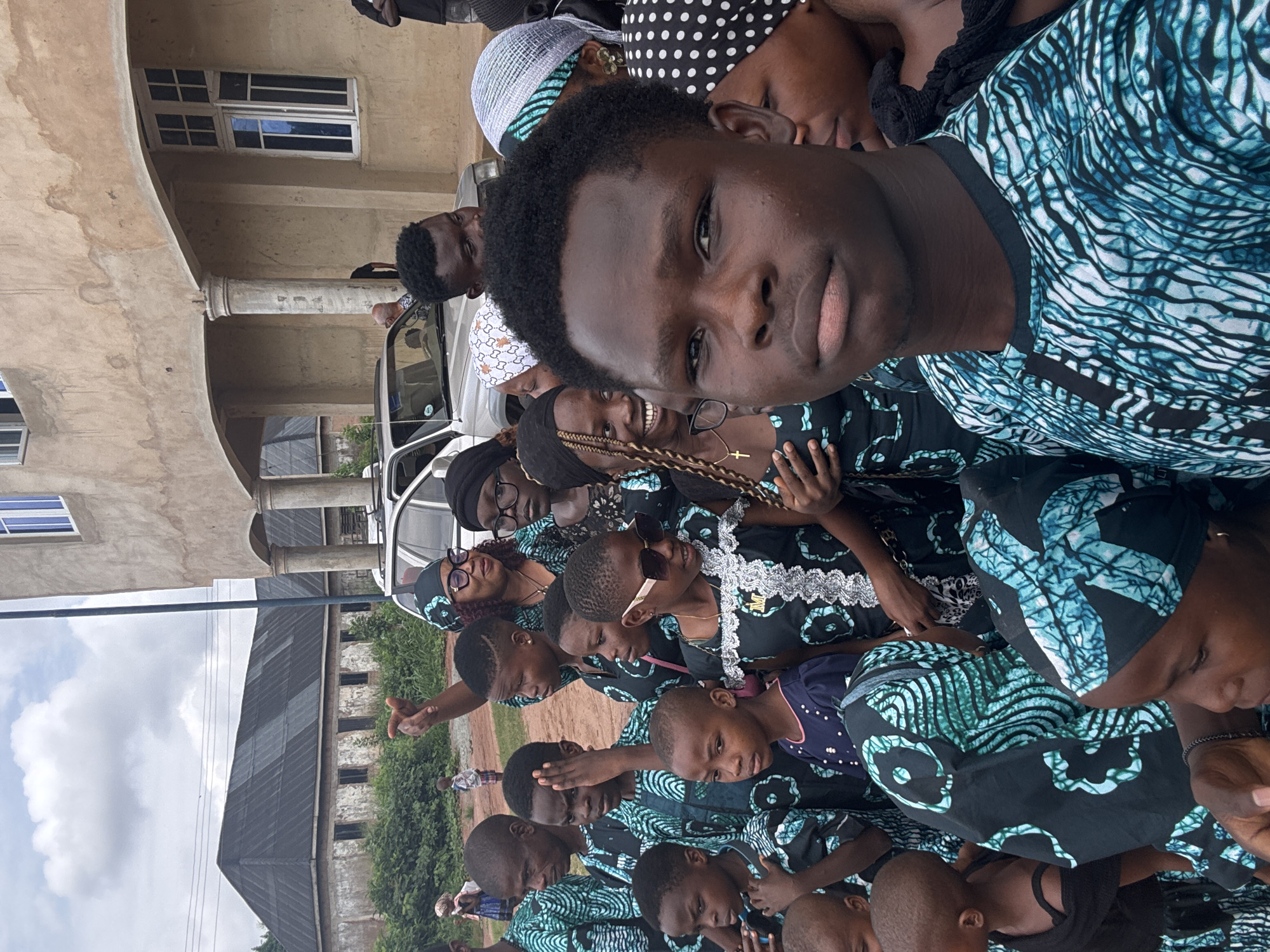 Coordinated group gathering for photos in Eziudo, Nigeria