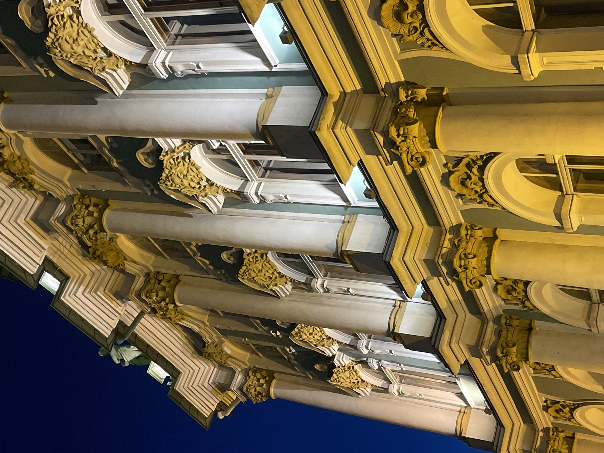 Ornate Saint Petersburg building photographed at night from multiple angles