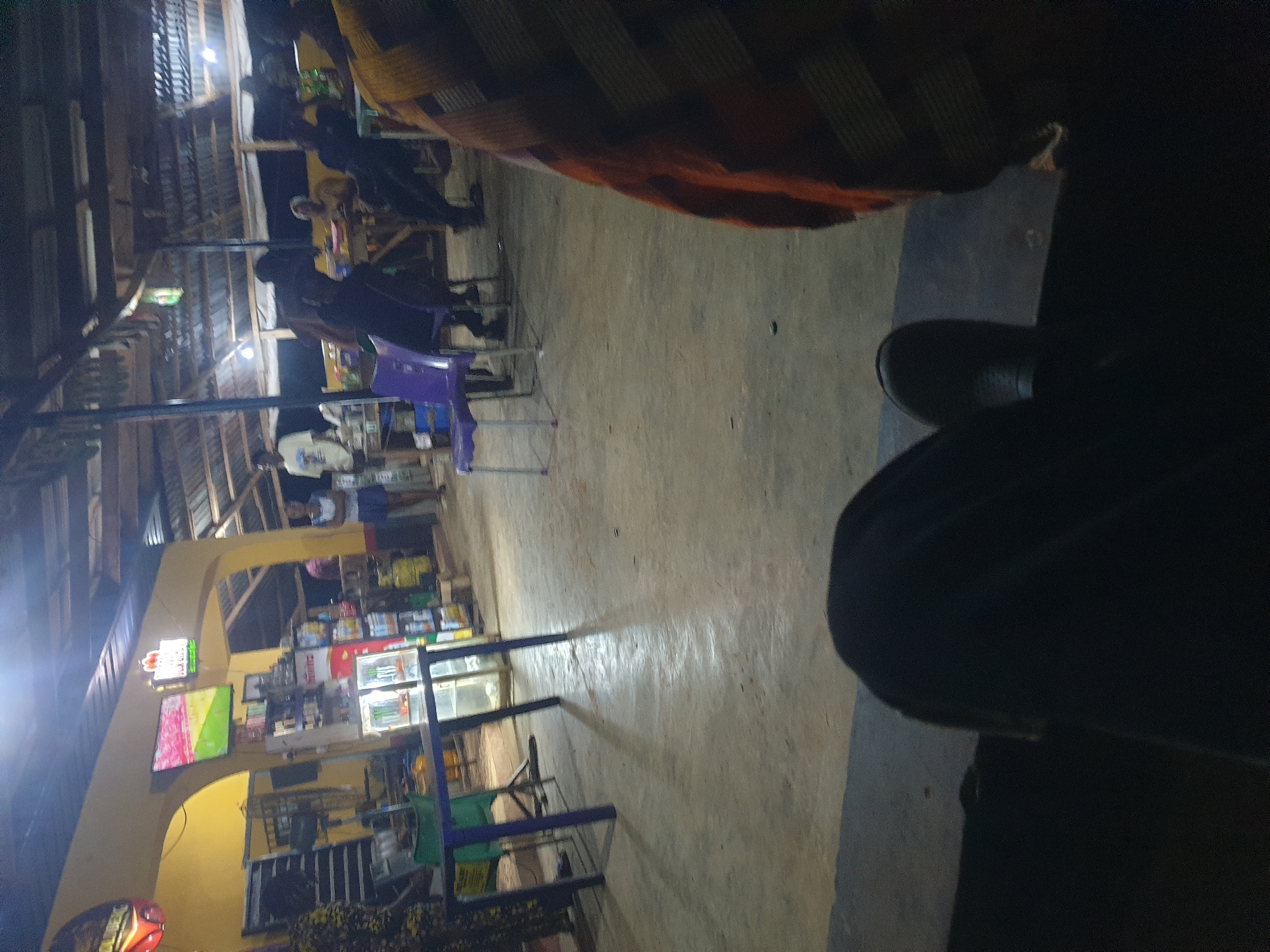 Evening social gathering at outdoor bar in Nigeria