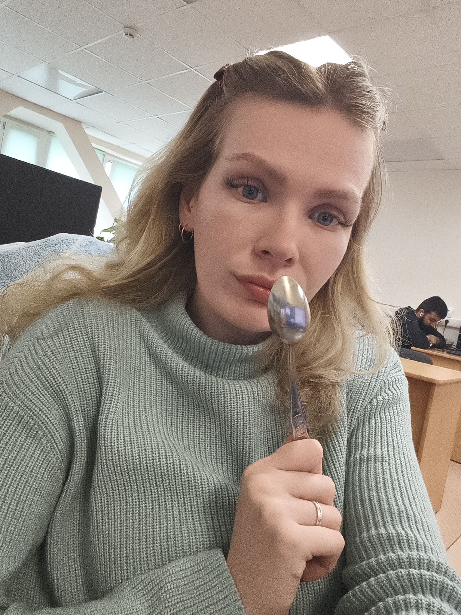 Woman with spoon photographed in Izhevsk, Russia