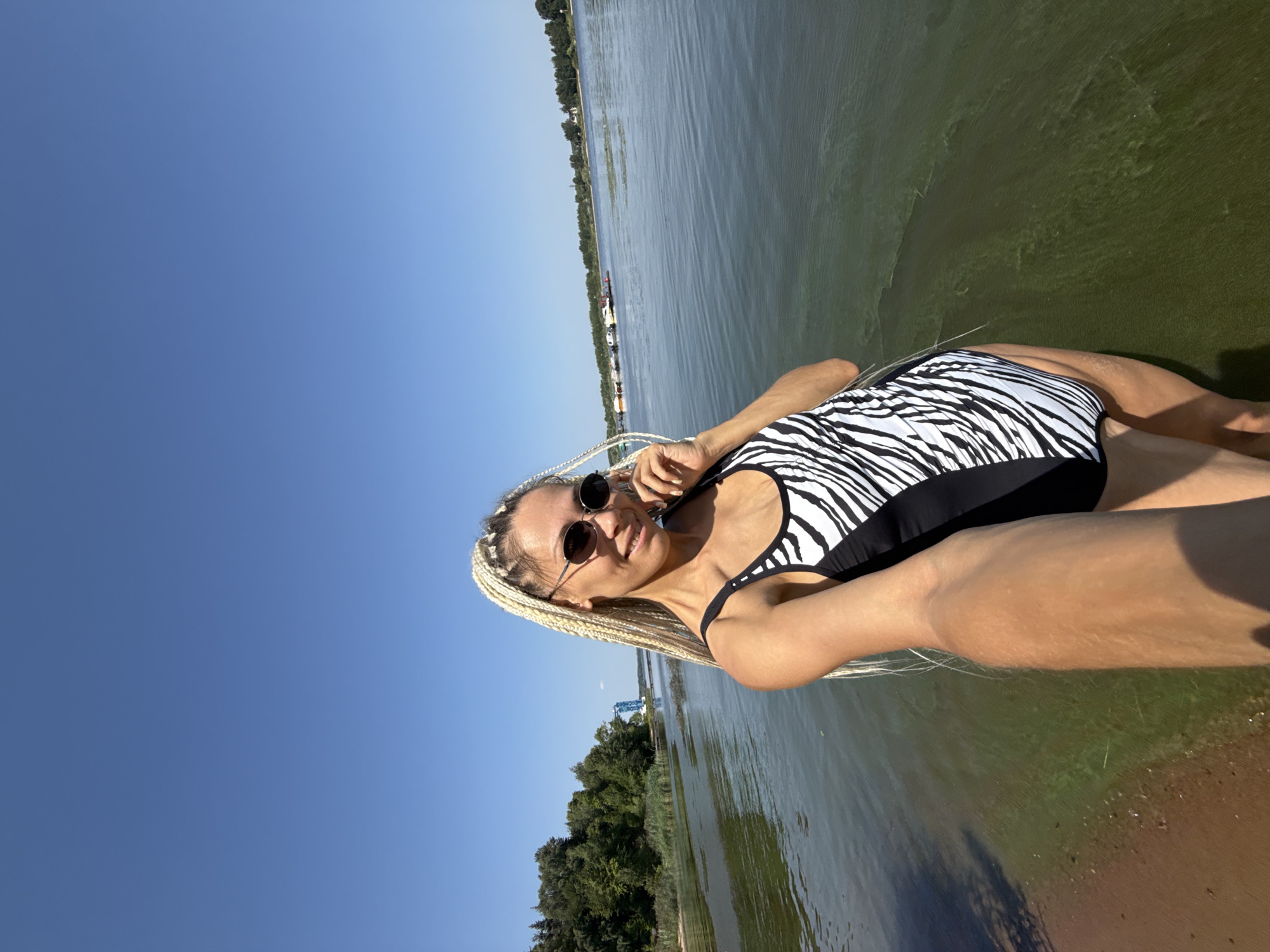 Summer morning at a Russian lakeside beach, July 2026