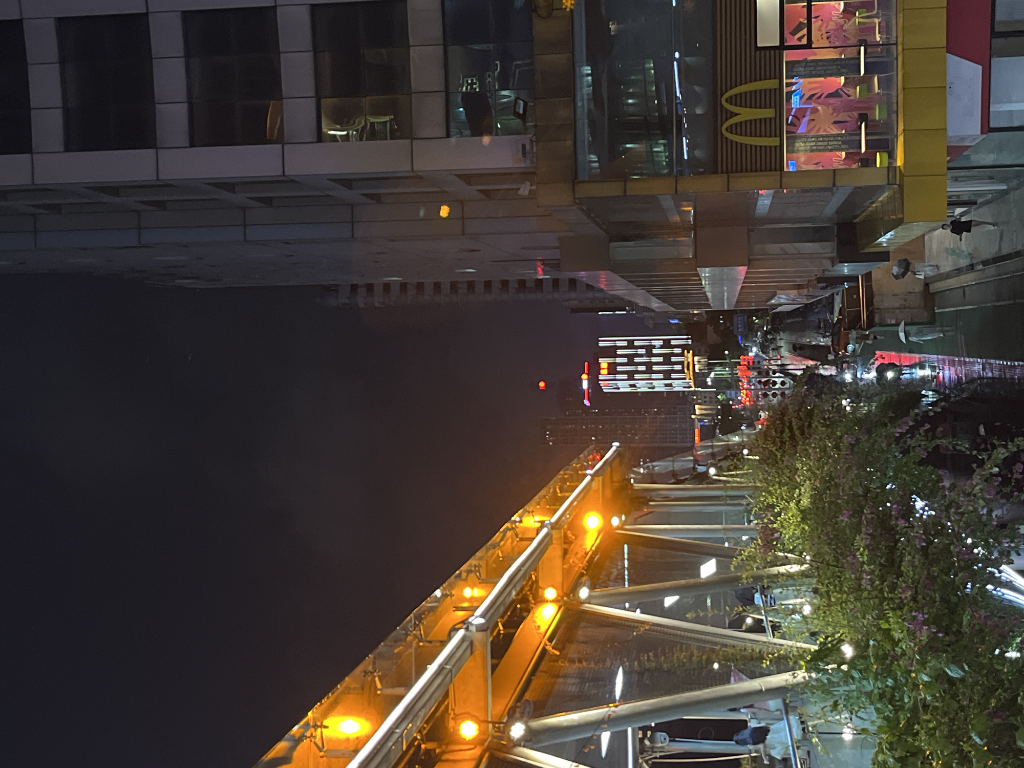 Rainy night in Nanhai District with street scenes and a craft display