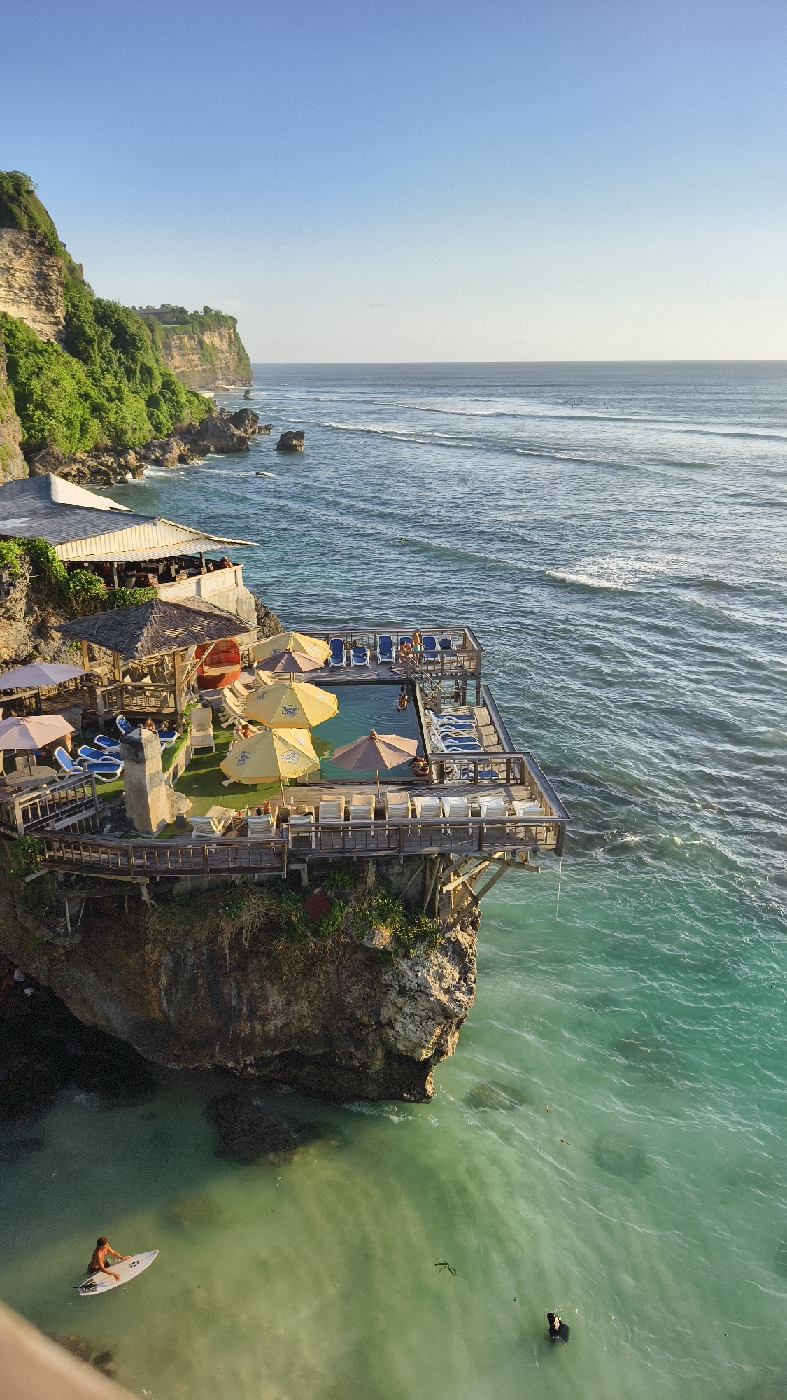 Morning clifftop party with live music overlooks surfers in Pecatu