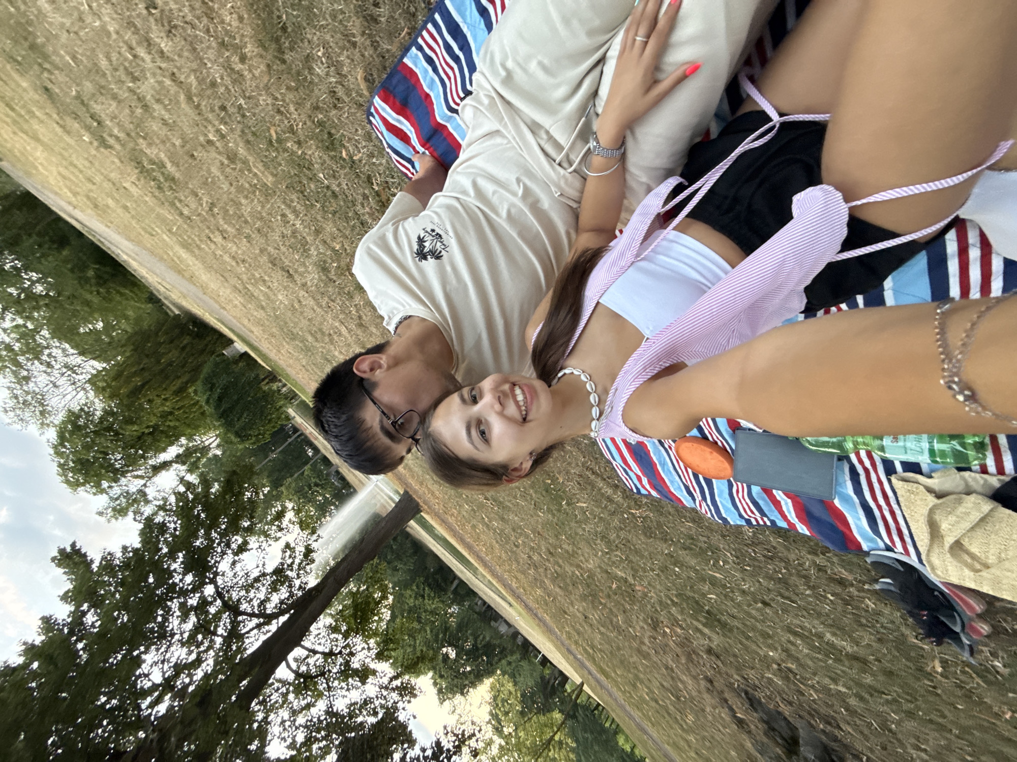 Picnic blanket hangout in a Hanau park, summer evening