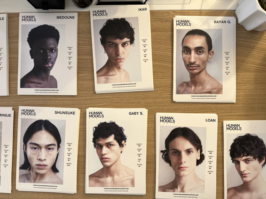 Model composite cards displayed on desk in Paris