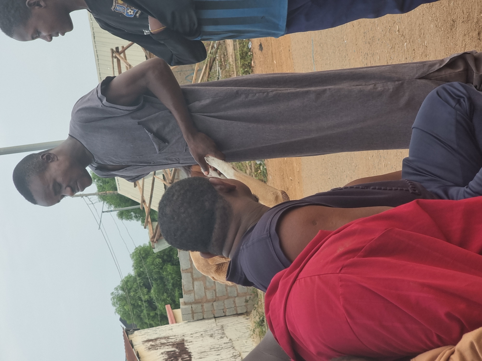 Everyday moments captured in Gwagwalada: men gathering, child feeding